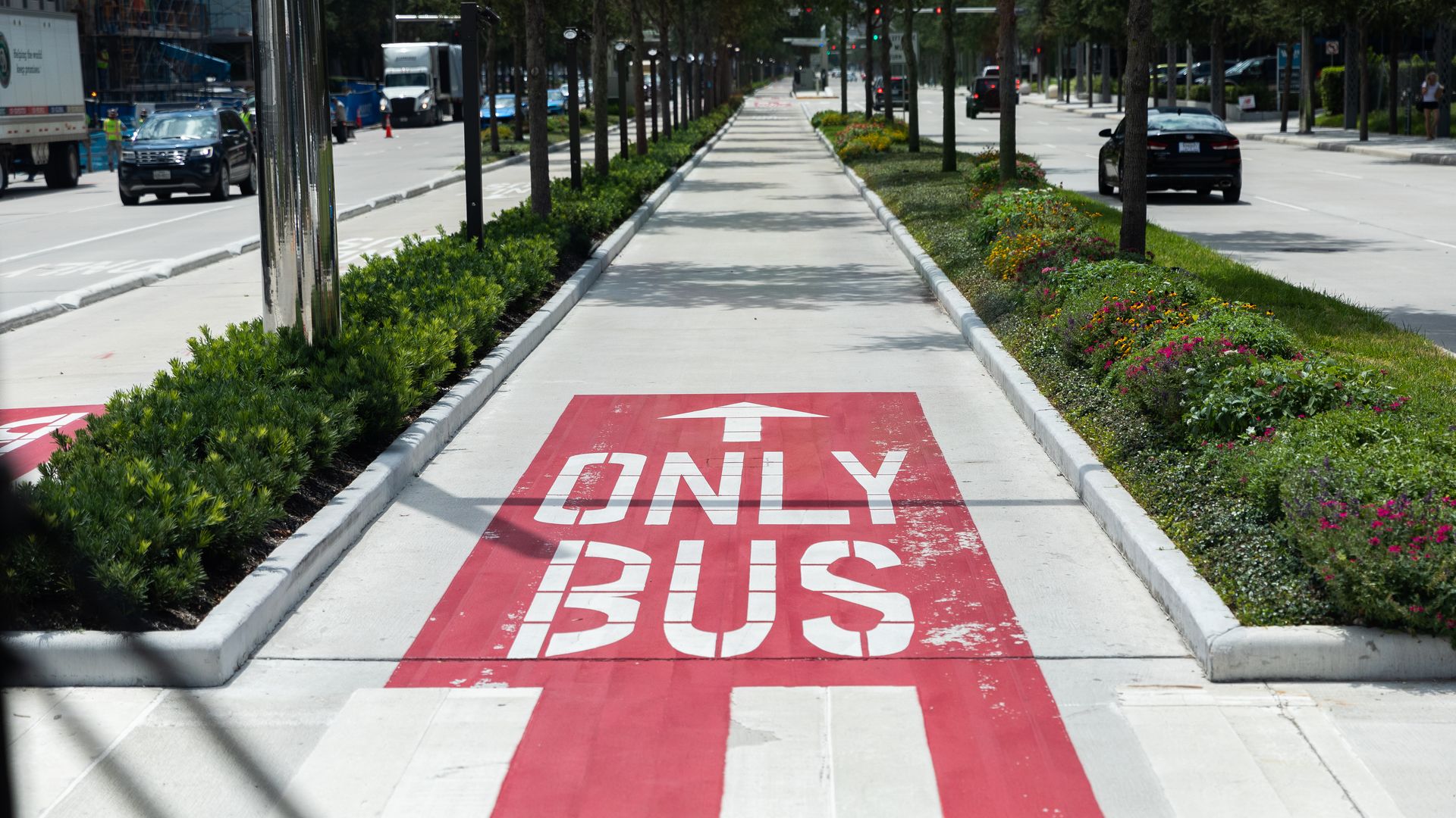 shot of a bus rapid transit lane with the words "BUS ONLY" painted on the street