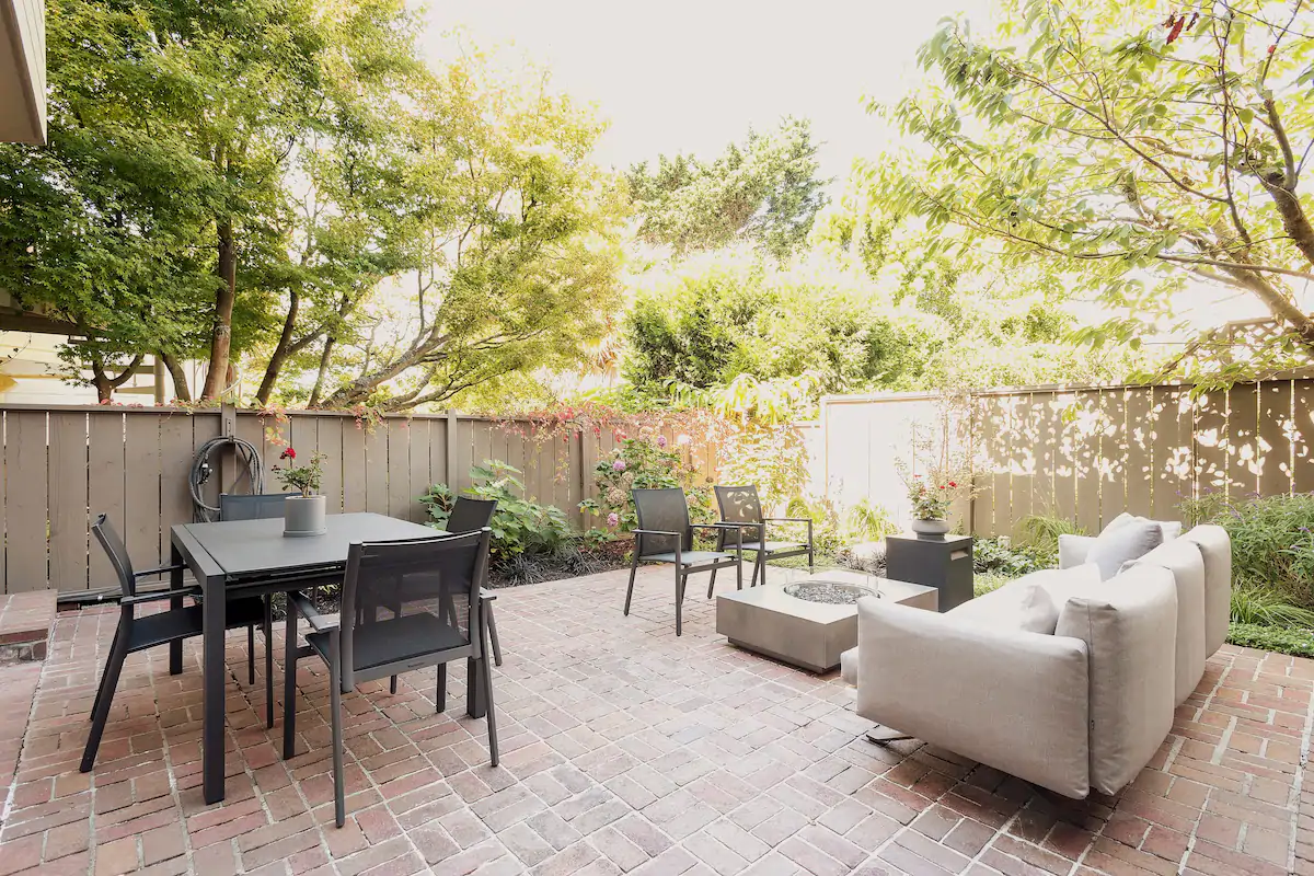 spacious outdoor dining area with couch