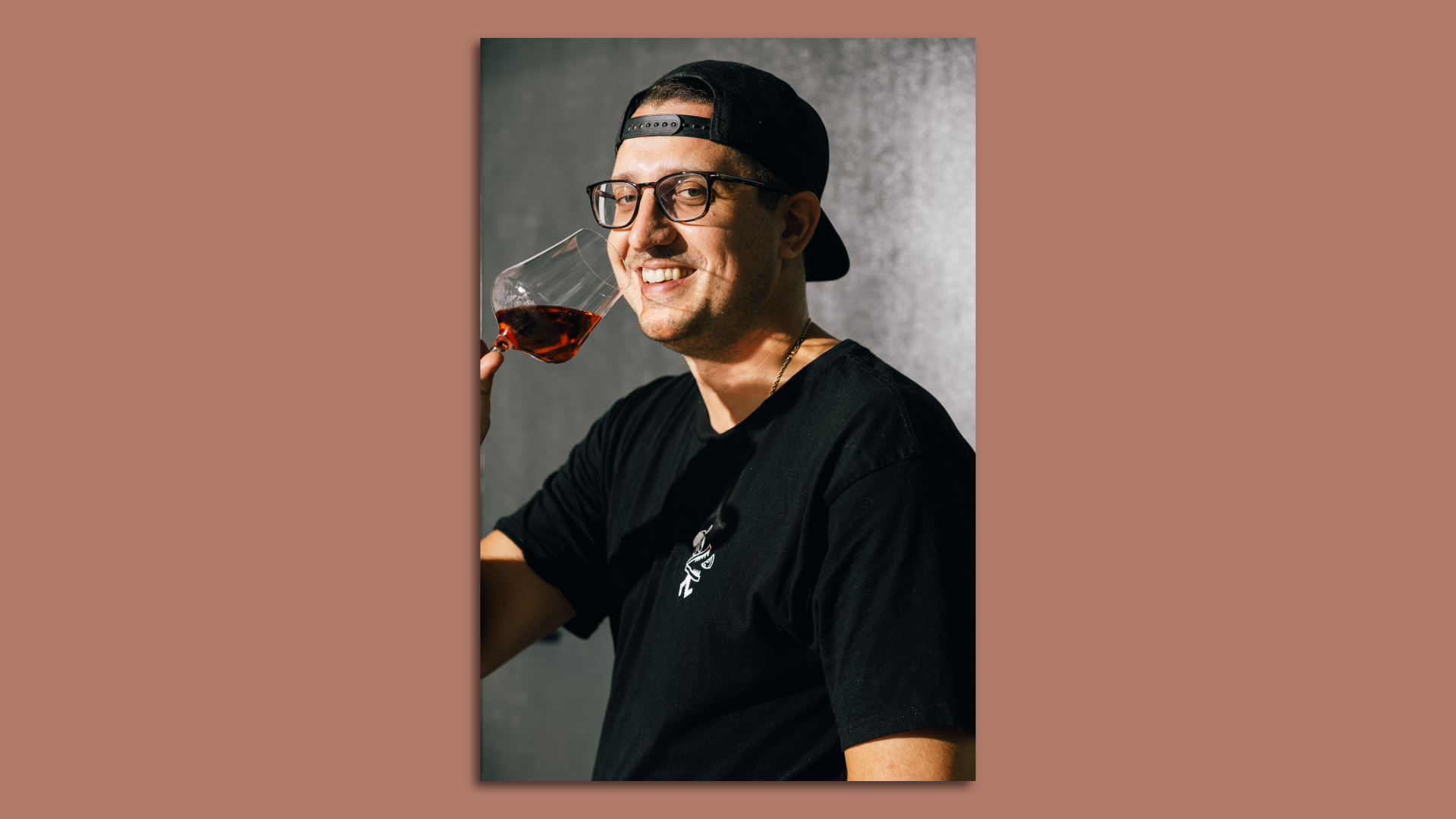 Anthony Guerra drinking a glass of wine