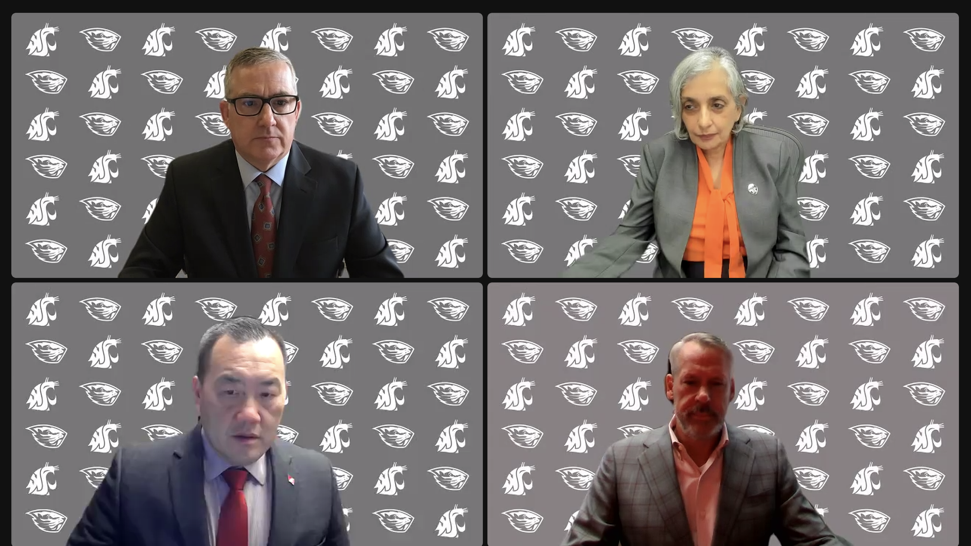 A screenshot of four people participating in a video conference. All have a background that is grey with the mascots of Oregon State University and Washington State University in white. 