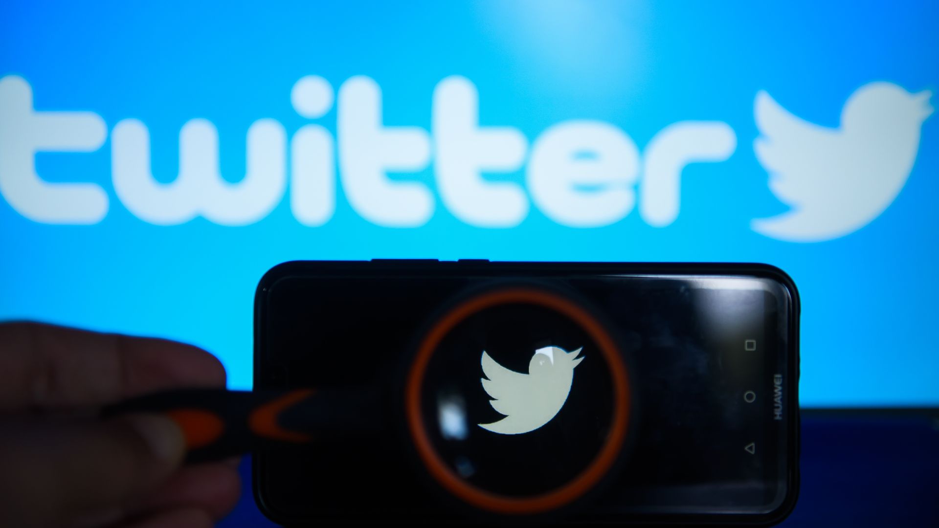 Twitter logo on a phone