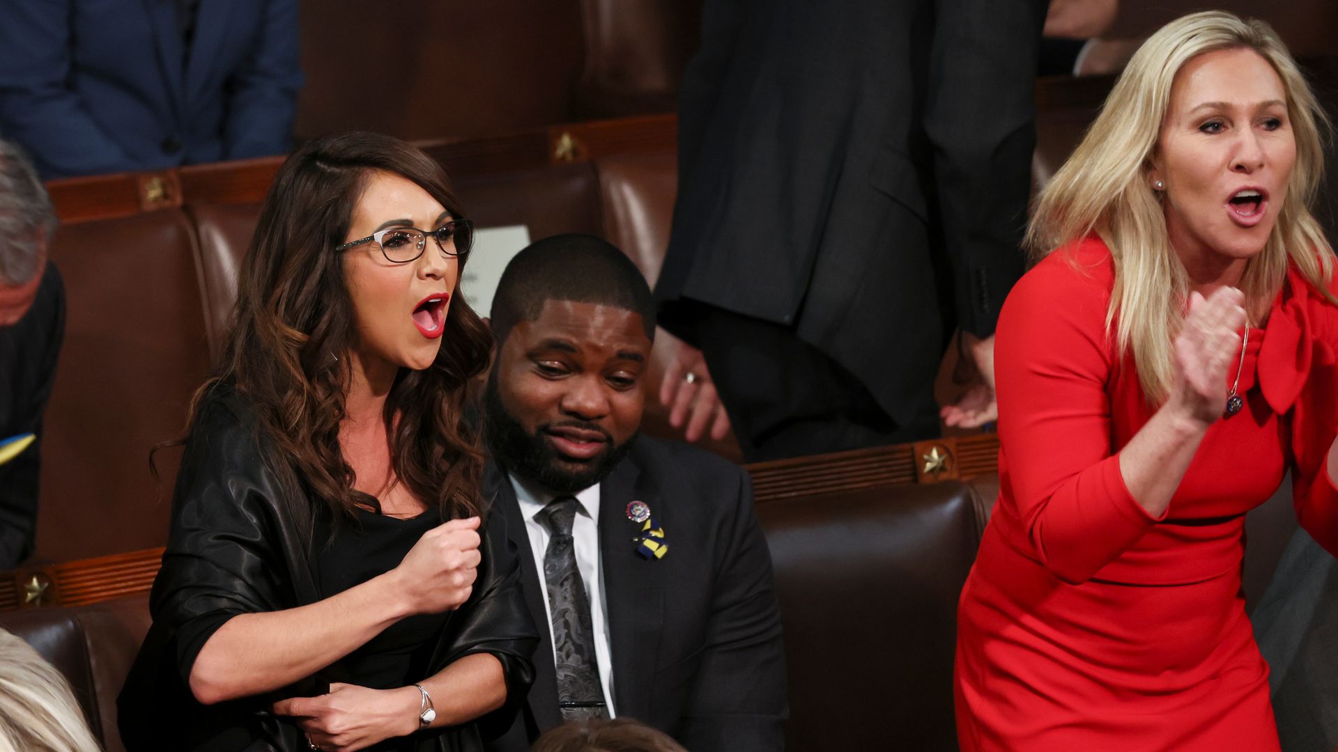 Reps. Lauren Boebert and Marjorie Taylor Greene are seen shouting during President Biden's State of the Union address.