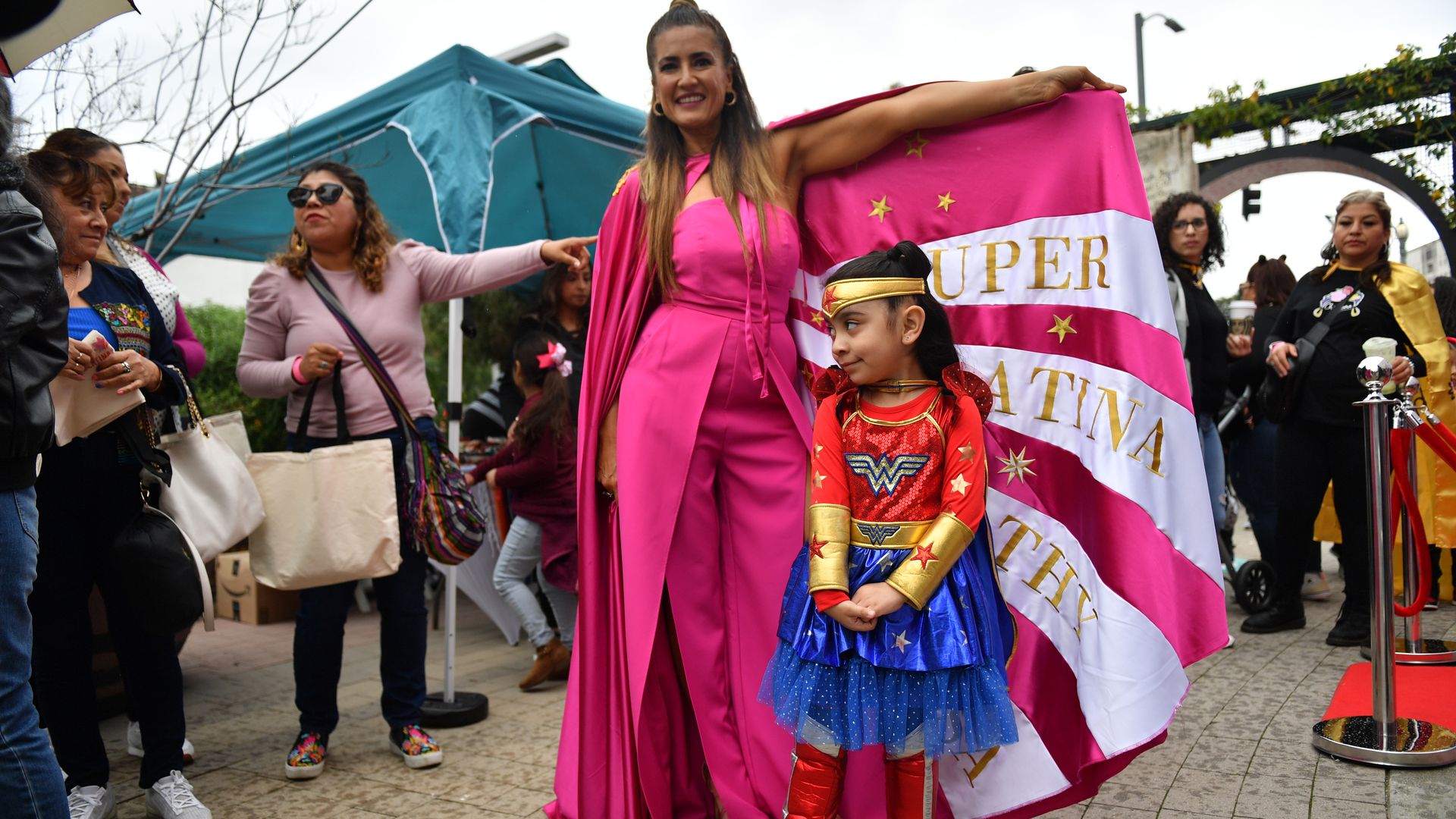 LATINAFest co-founder Naibe Reynoso poses with a young attendee at the 5th annual LATINAFest celebrating Women's History Month by honoring Latina pioneers at LA Plaza de Cultura y Artes on March 19, 2023 in Los Angeles