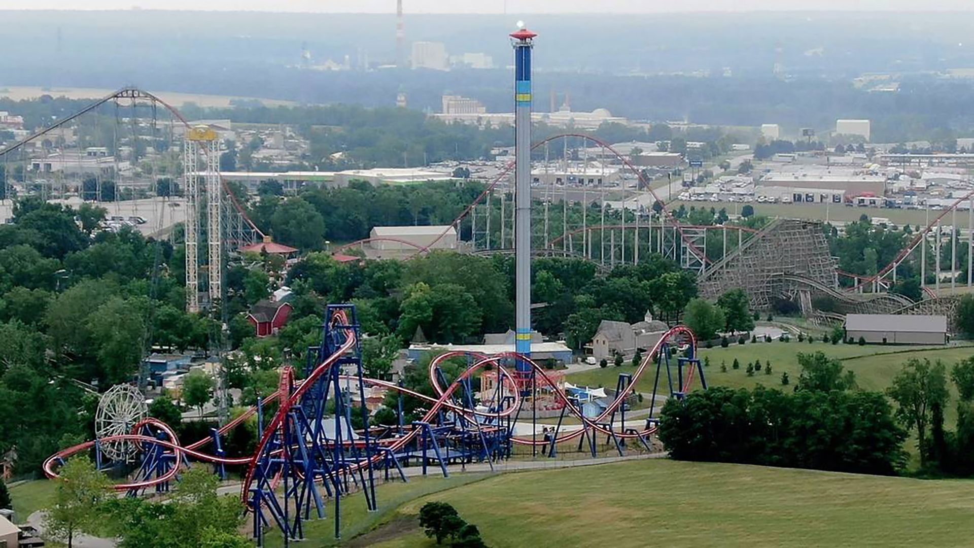 Zoomed out aerial image shows multiple roller coasters and a space shot at Worlds of Fun in Kansas City. 
