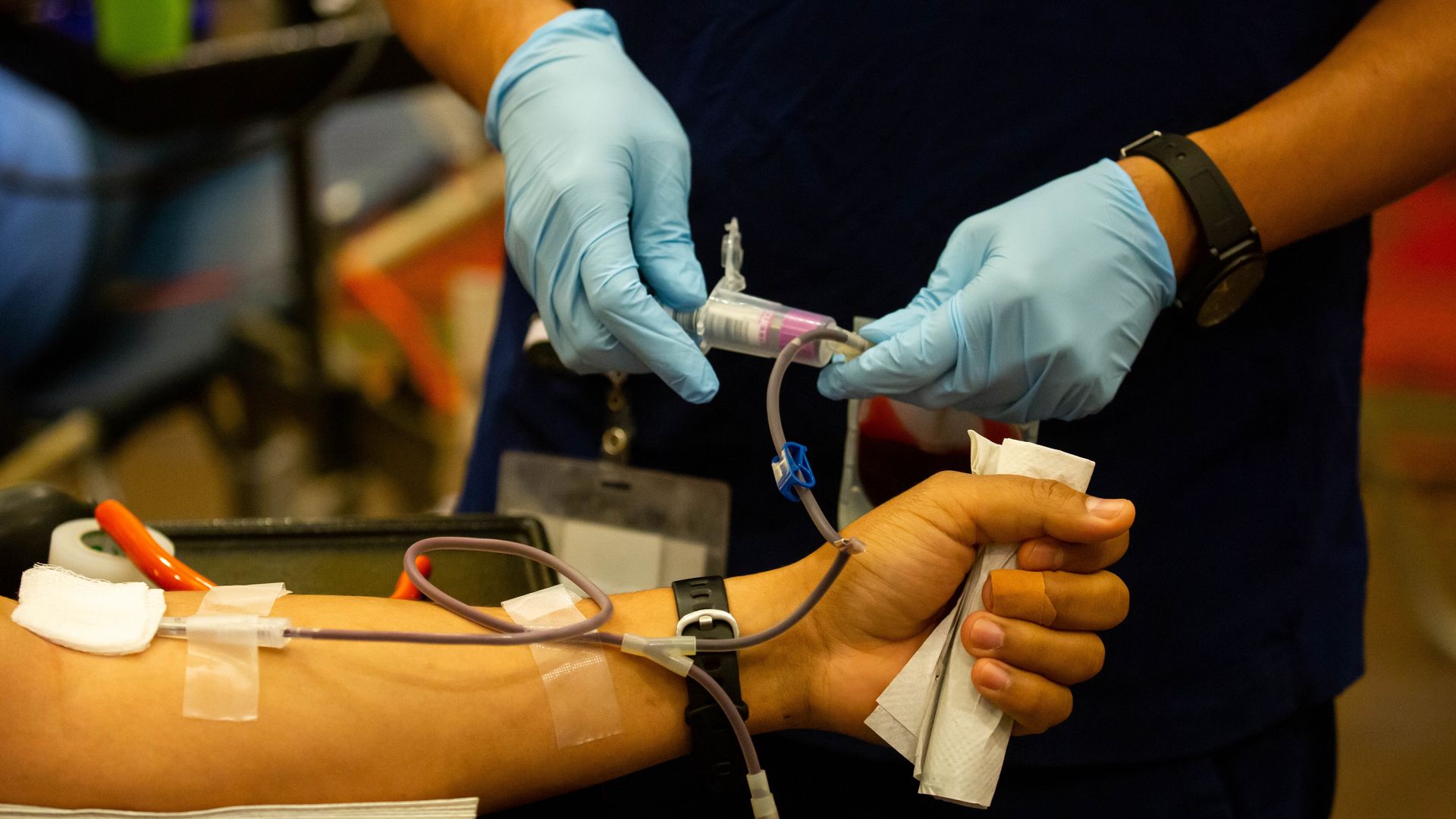 A health care worker taking a donor's blood at a drive hosted by the New York Blood Center in New York City on June 14.