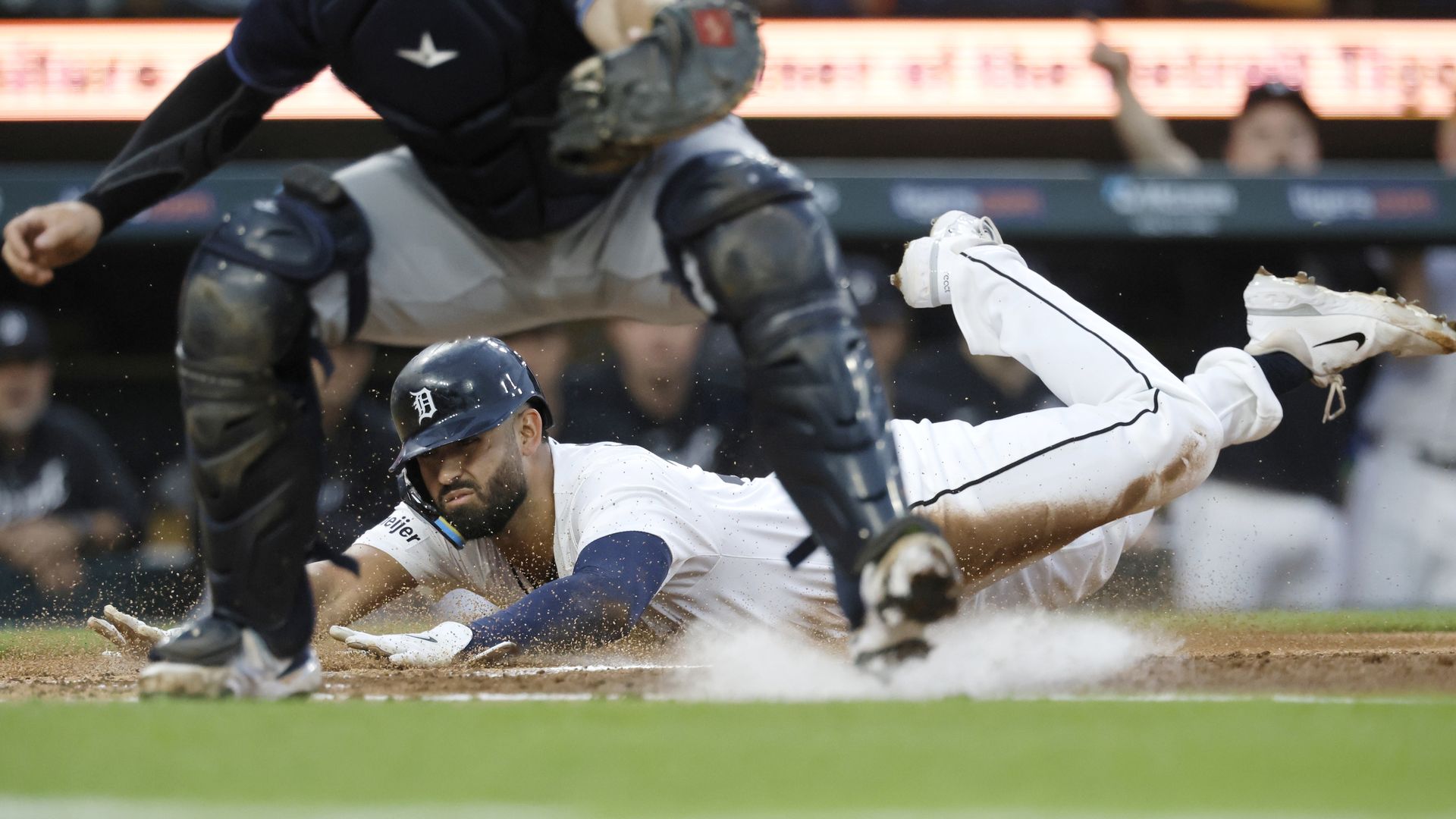 Tigers outfielder Riley Greene slides in safe at home against the Tampa Bay Rays on Wednesday.