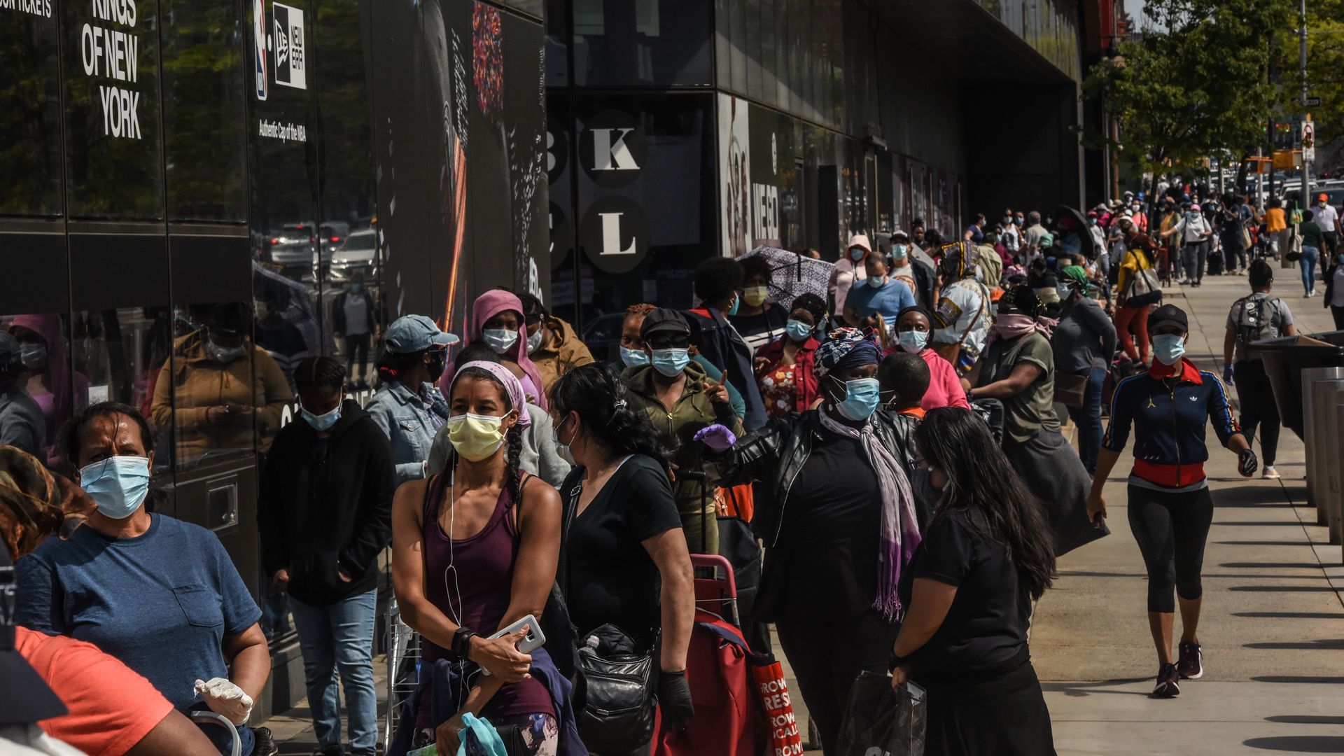 People waiting in line to receive a food bank donation on May 15 in New York City.