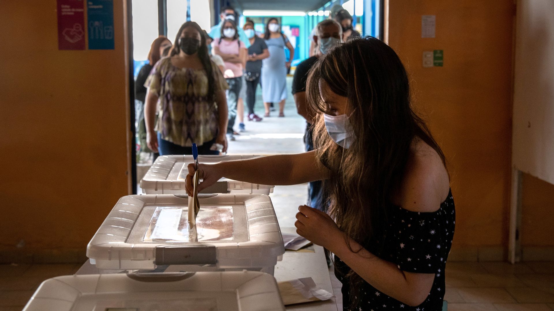 A voters casts her ballot during national elections on November 21, 2021 in Arica, Chile.