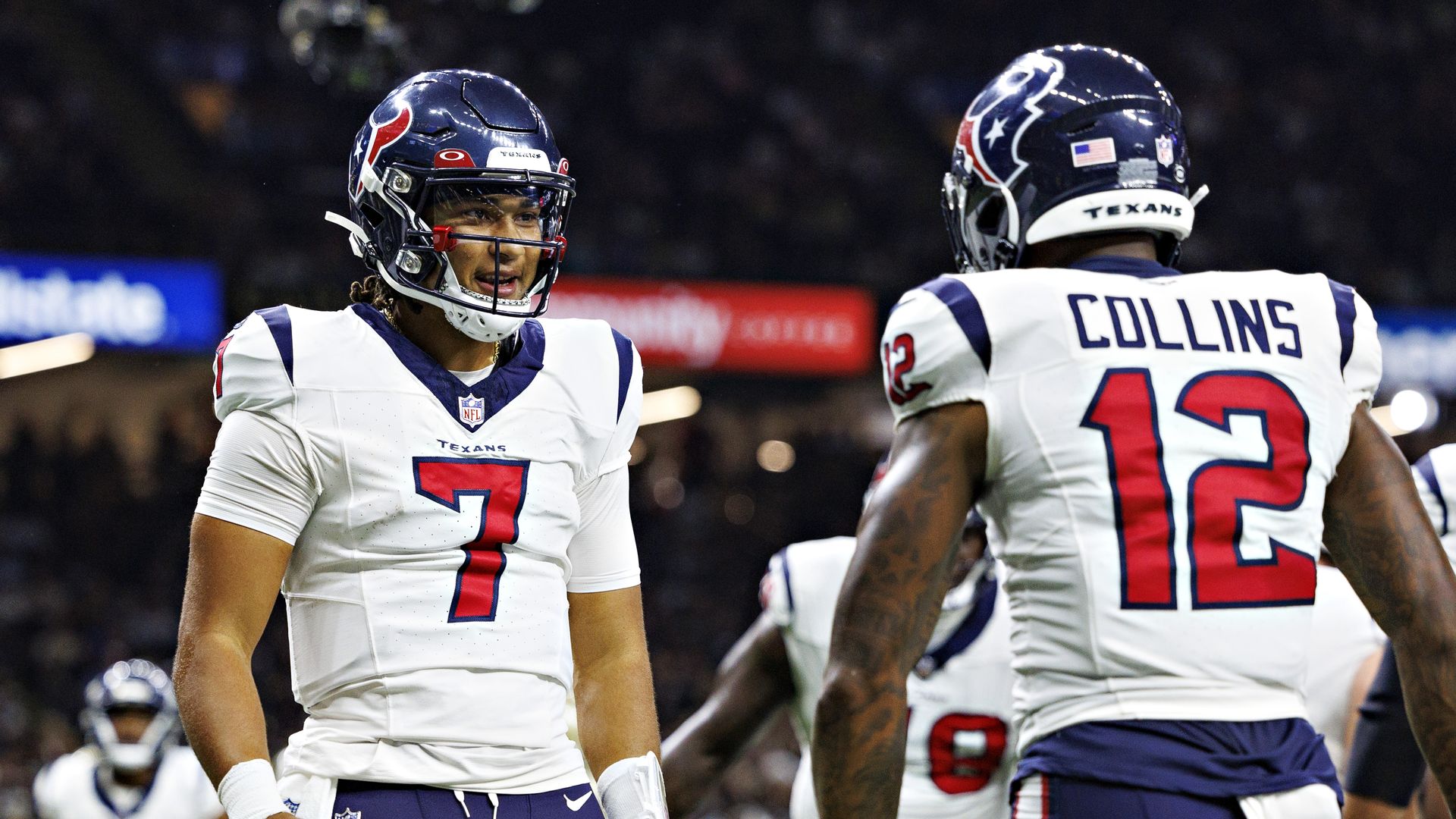 Nico Collins #12 celebrates with C.J. Stroud #7 of the Houston Texans after a touchdown during the preseason game against the New Orleans Saints at Caesars Superdome on August 27, 2023 in New Orleans, Louisiana. The Texans defeated the Saints 17-13. 