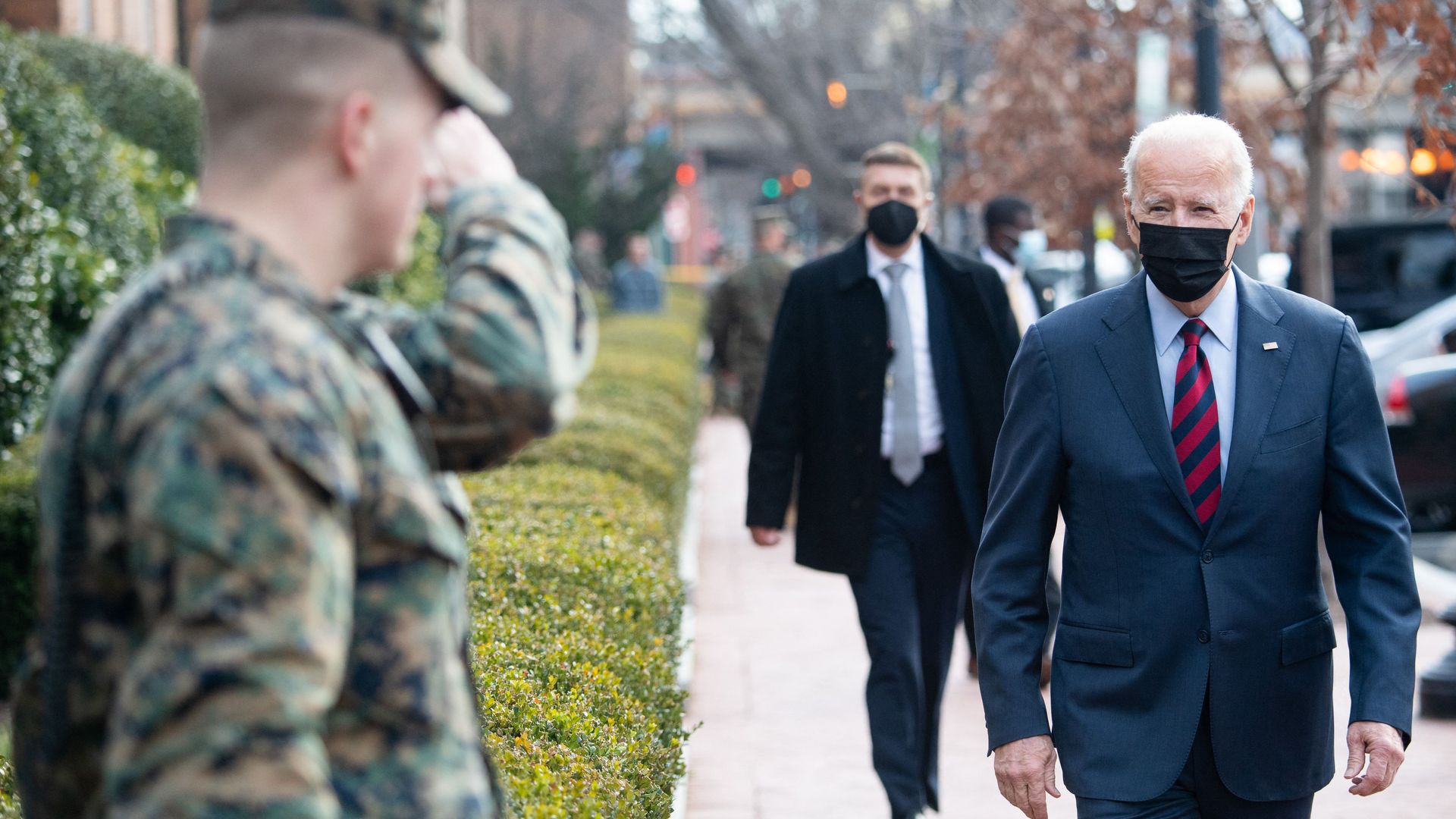 President Joe Biden greets US Marines outside the Marine Barracks as he makes a surprise walk down Barracks Row in Washington, DC, on January 25, 2022