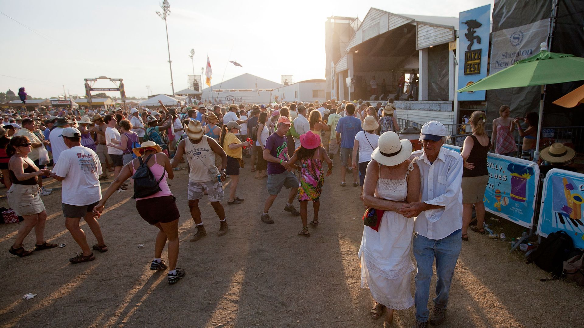 A light crowd dances in front of the Fais Do Do Stage at Jazz Fest.