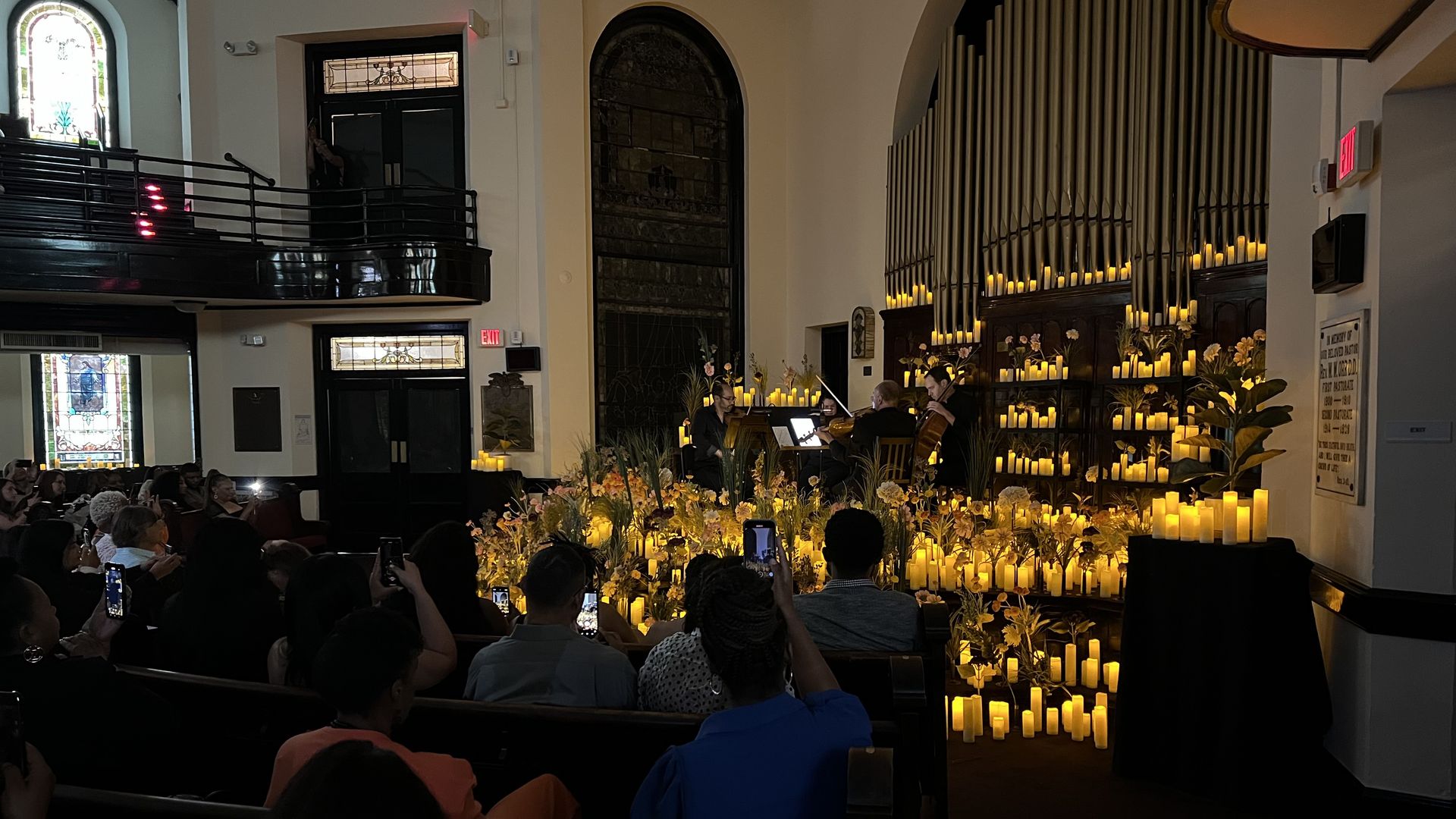 live musicians performing with hundreds of candles on stage