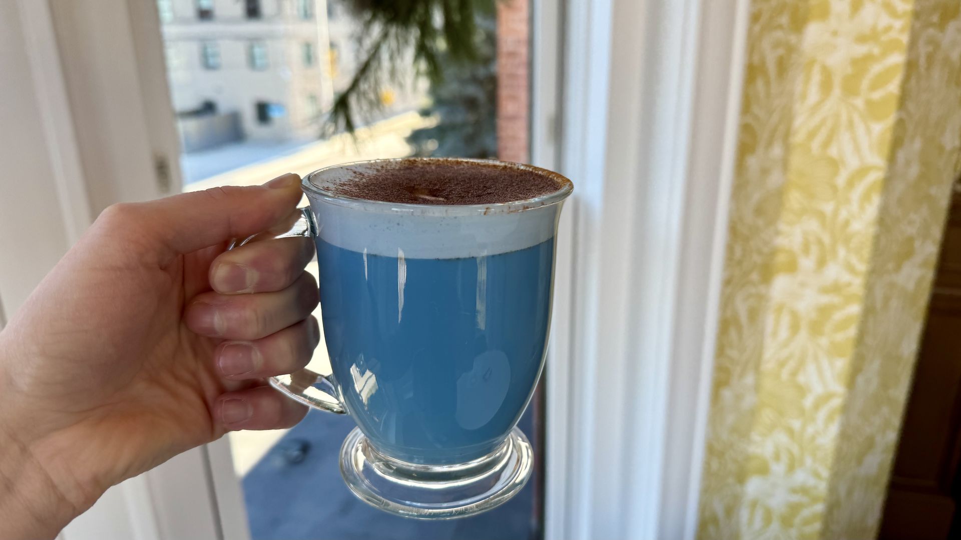The blue latte in a clear cup.
