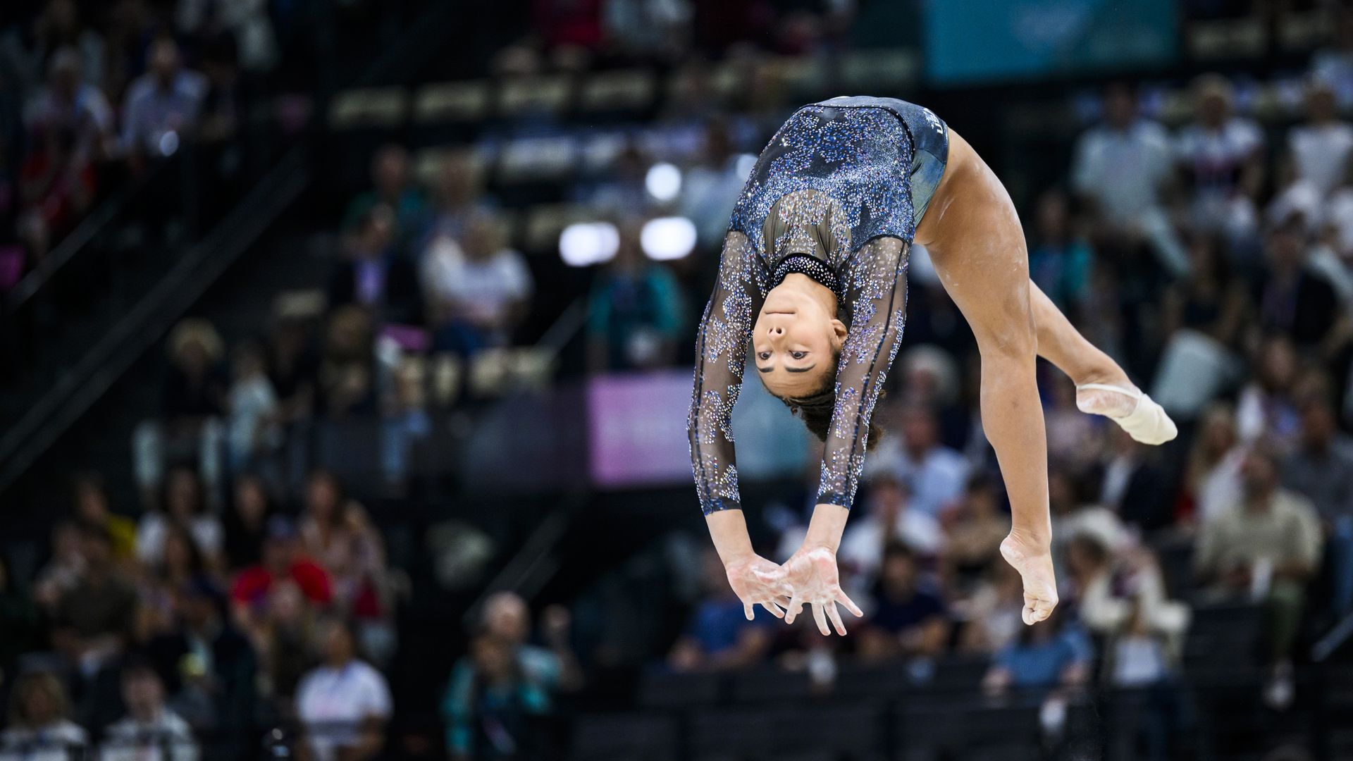 A gynmast spins into the air