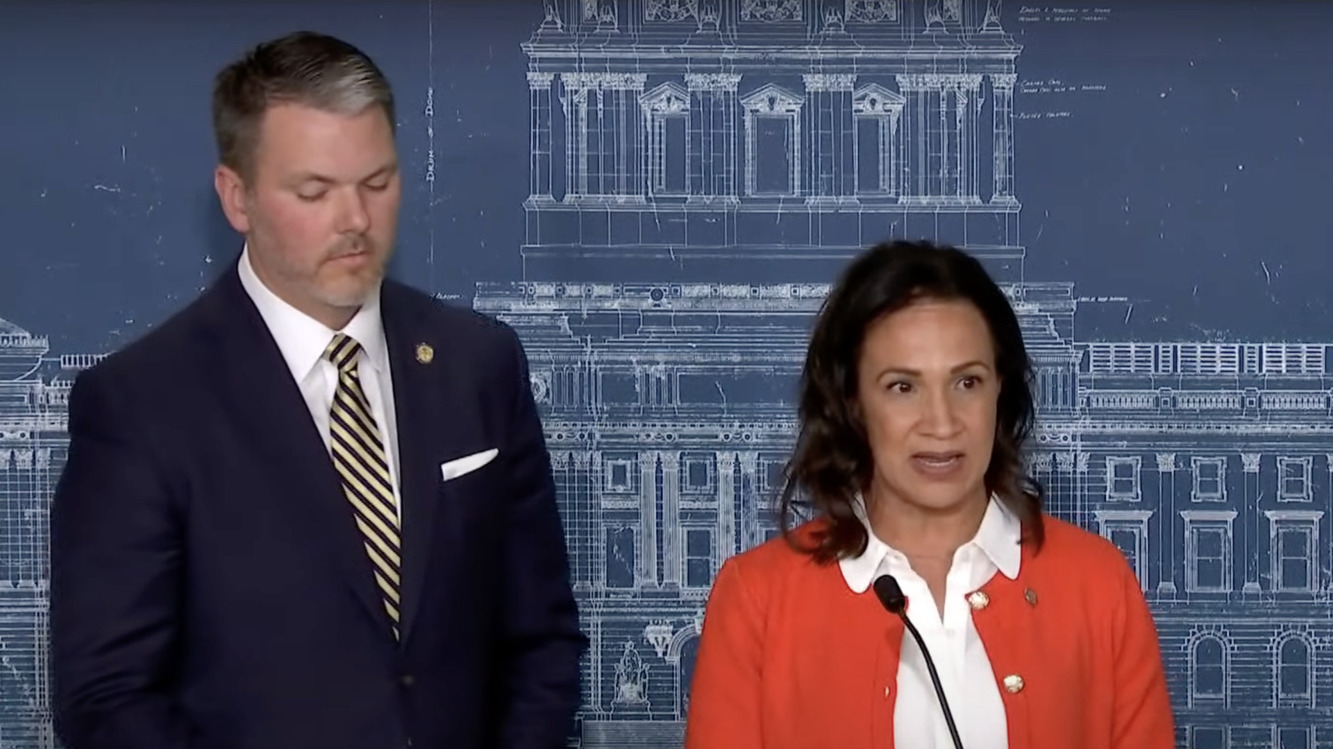 Mark Johnson and Lisa Demuth at a podium