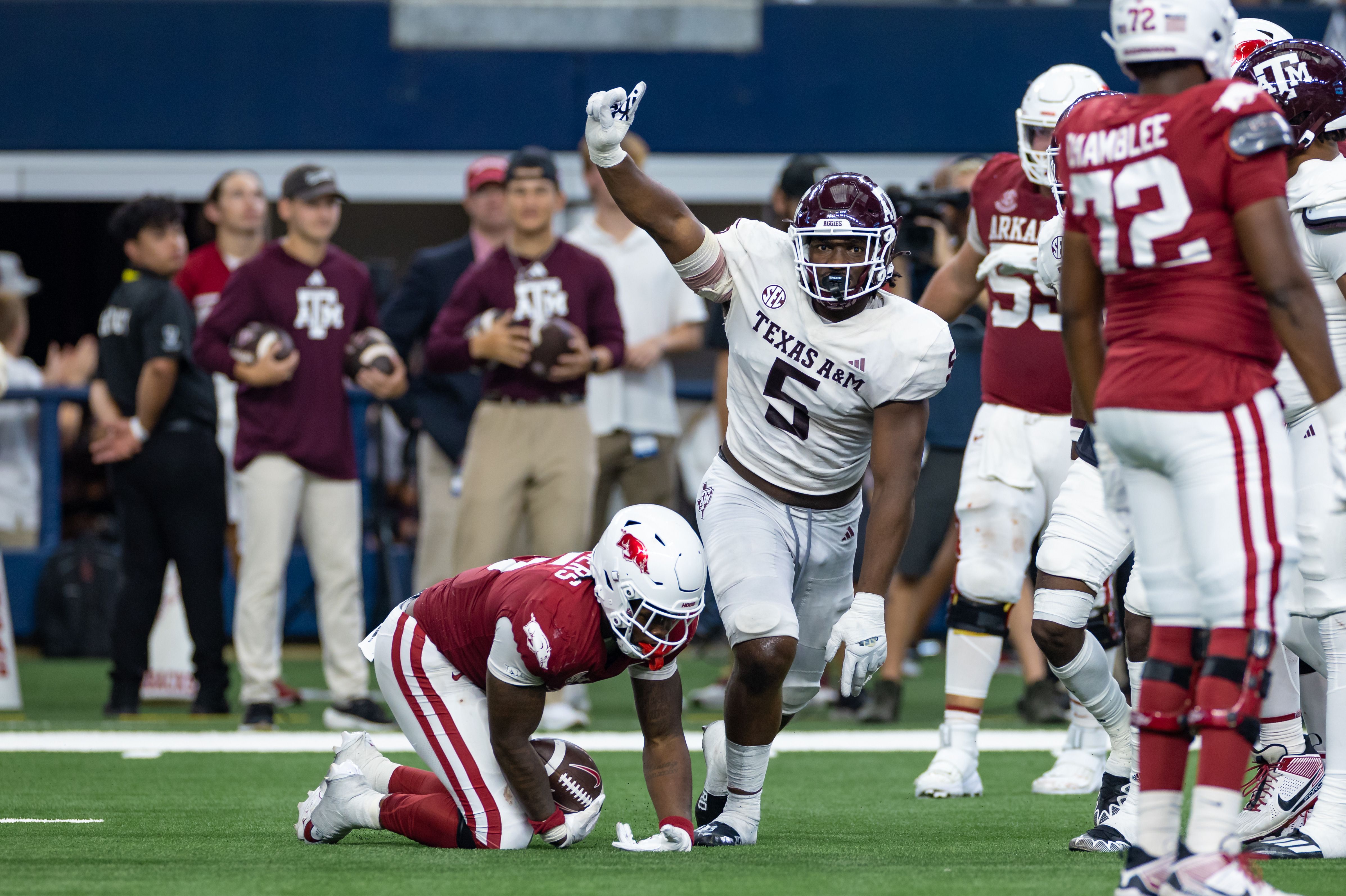 Photo of a football player making a tackle during a game. 