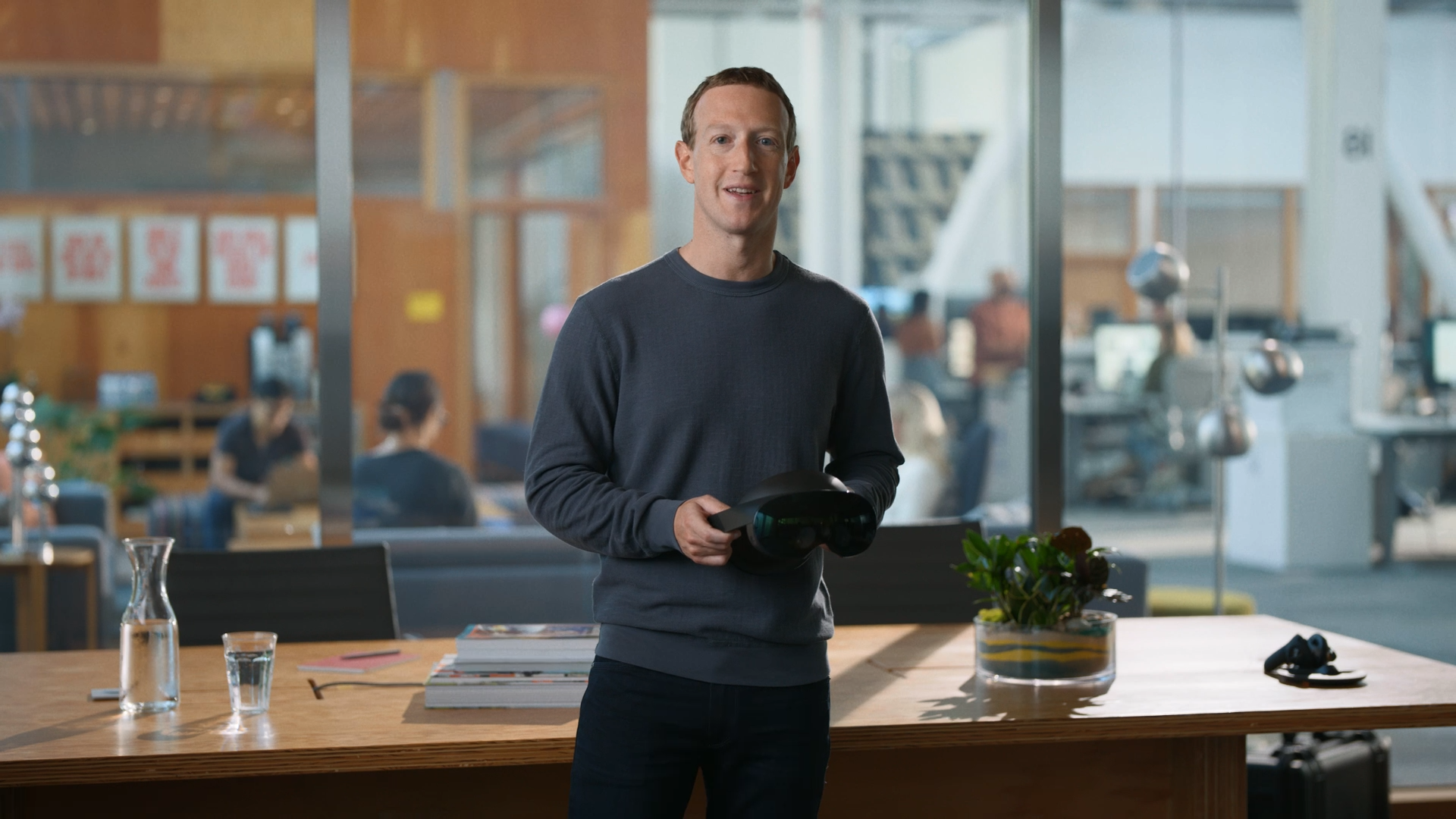 Meta CEO Mark Zuckerberg holding a Quest Pro VR headset.