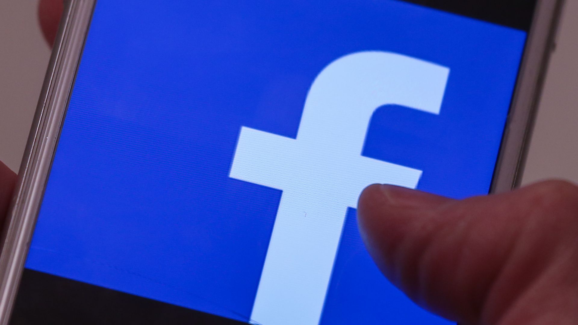 Facebook logo on a phone