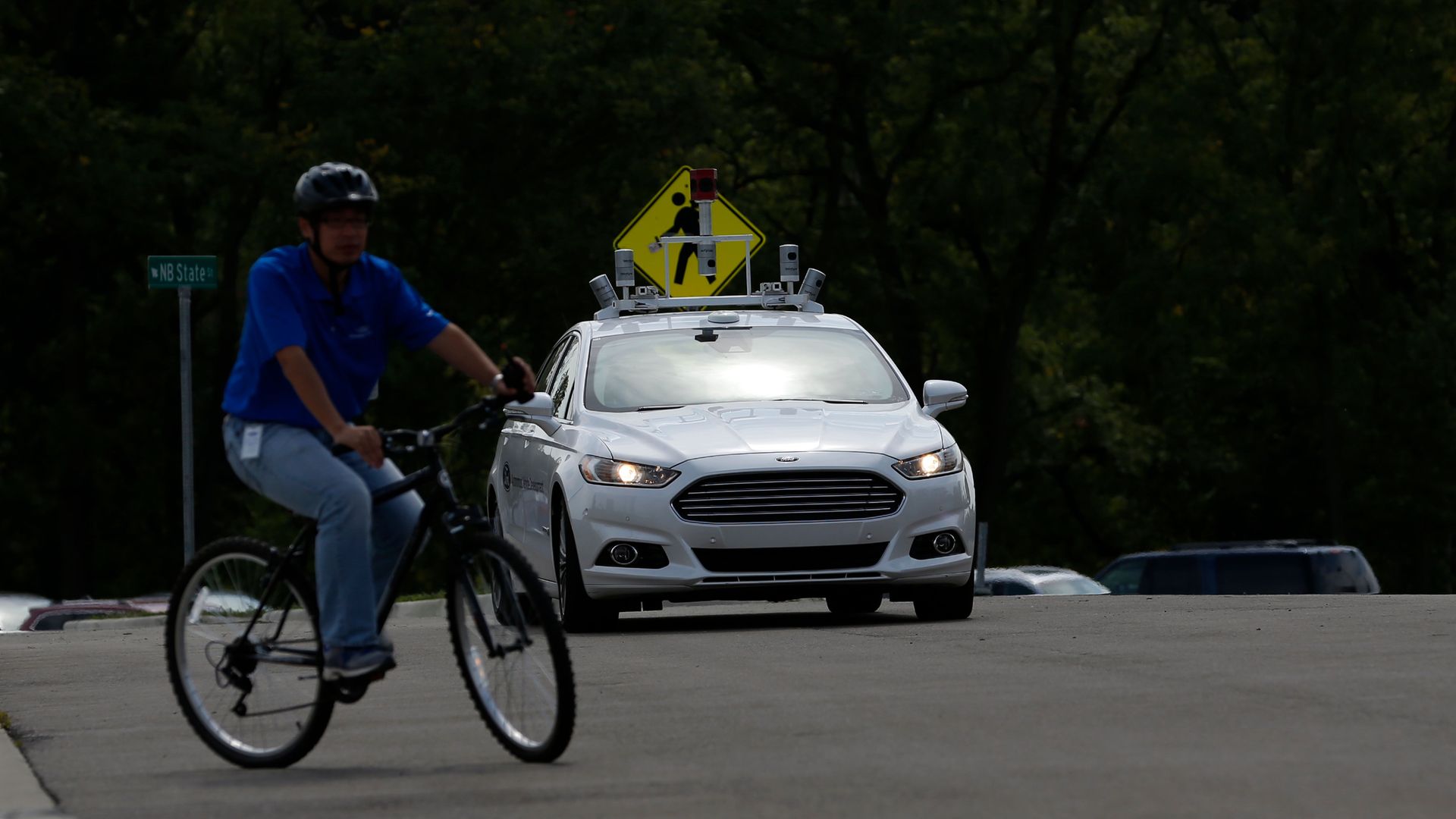 A Ford Fusion with Level 4 Autonomous controls maneuvers at the Mcity Test Facility in Ann Arbor, Michigan.