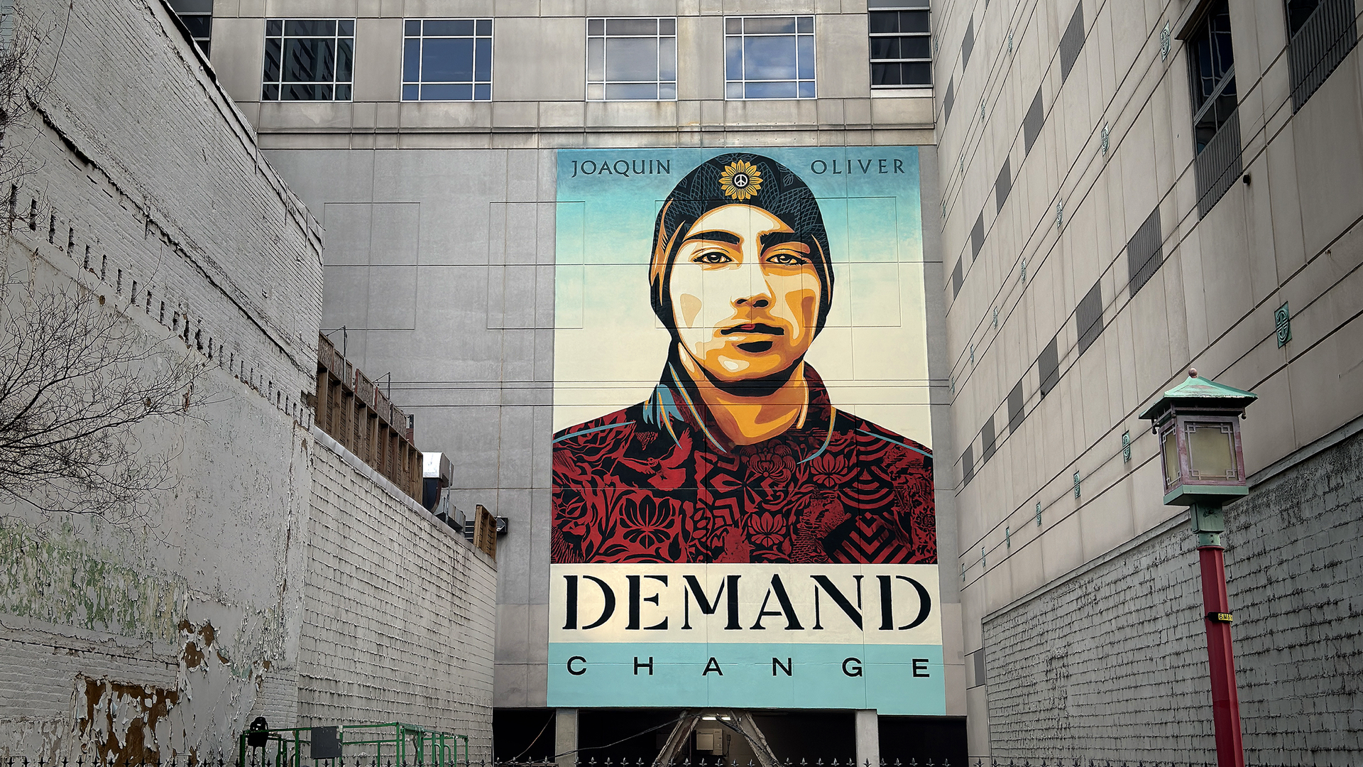 "We Demand Change," a new mural by Shepard Fairey in Chinatown. Photo: Courtesy of Woolly Mammoth Theatre Company