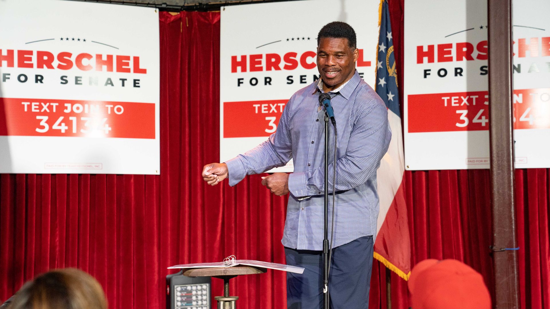 Herschel Walker on a stage