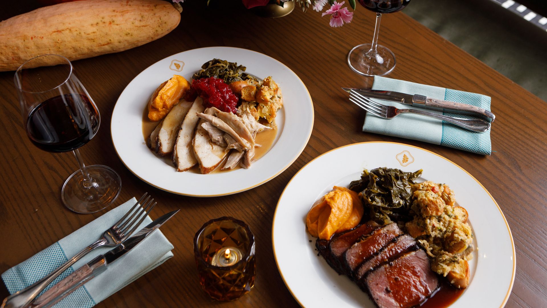A Thanksgiving table with turkey and roast beef dinners
