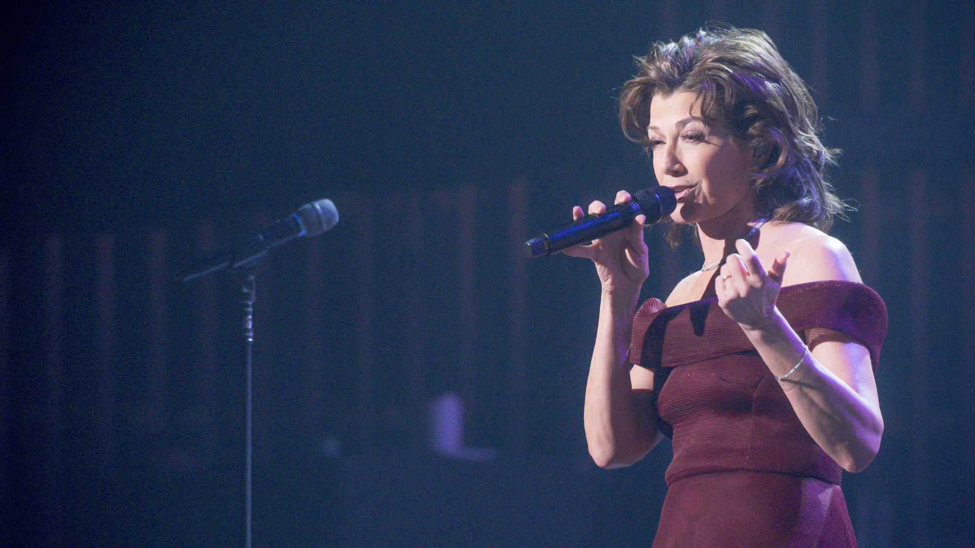 Amy Grant performs on stage during the Christmas Live concert at Smart Financial Centre on December 10, 2023 in Sugar Land, Texas.
