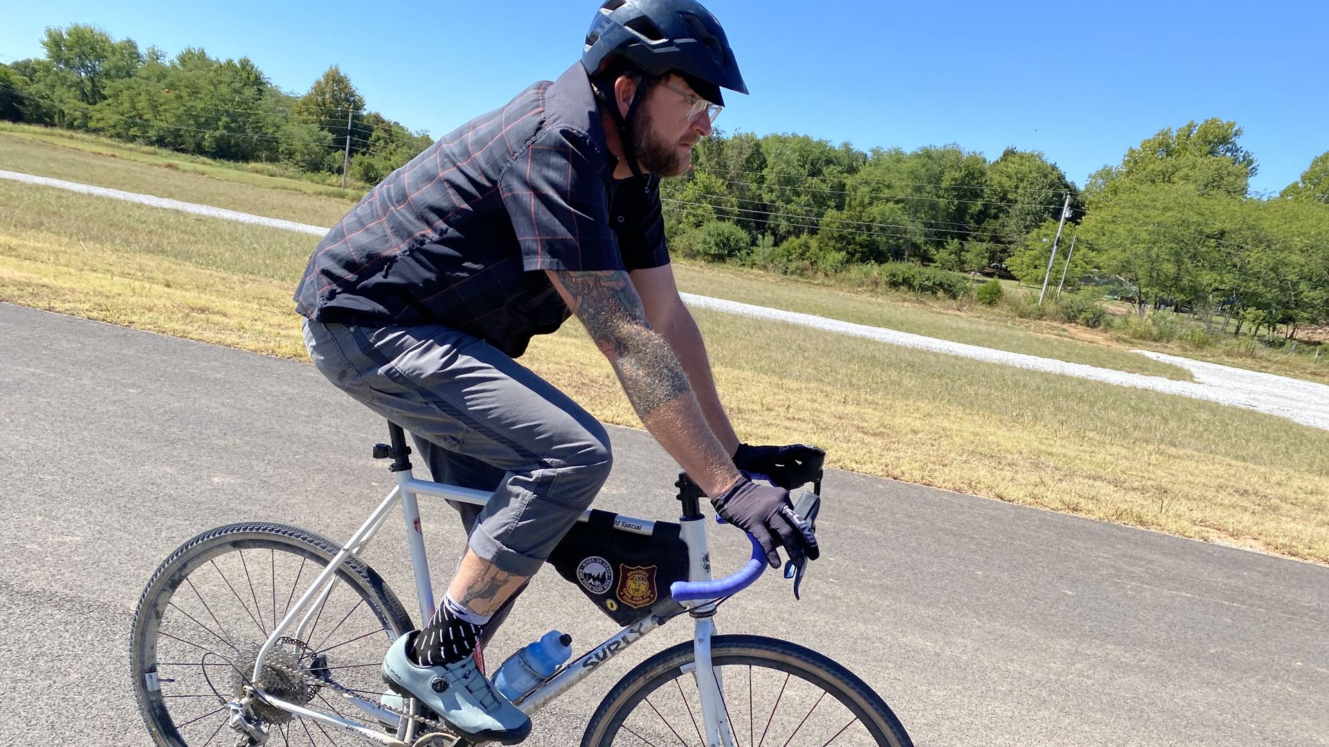 Brannon Pack, director of cycling tourism for Experience Fayetteville, rides a bike. 