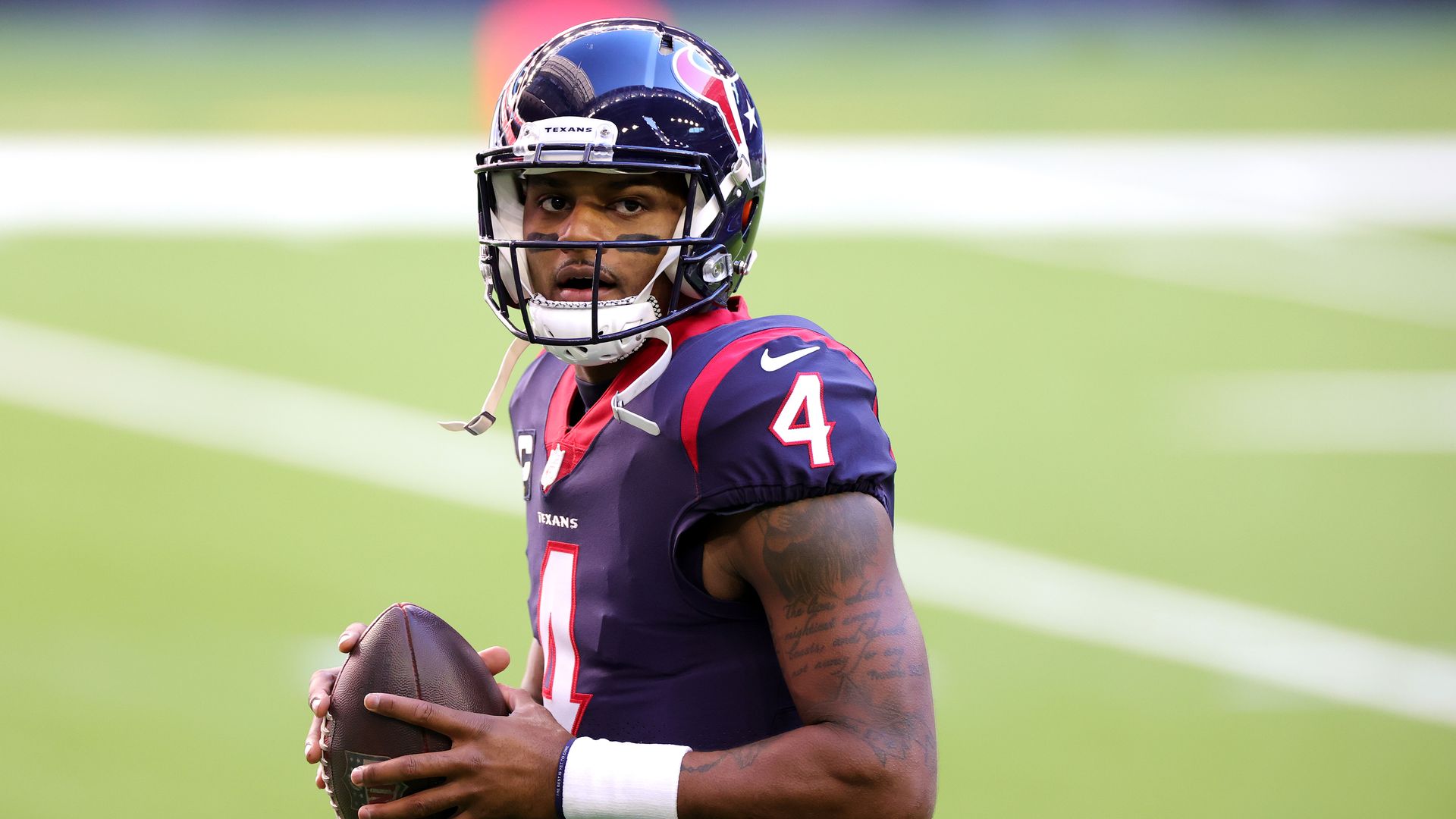 Deshaun Watson #4 of the Houston Texans in action against the Tennessee Titans during a game at NRG Stadium on January 03, 2021 in Houston, Texas.