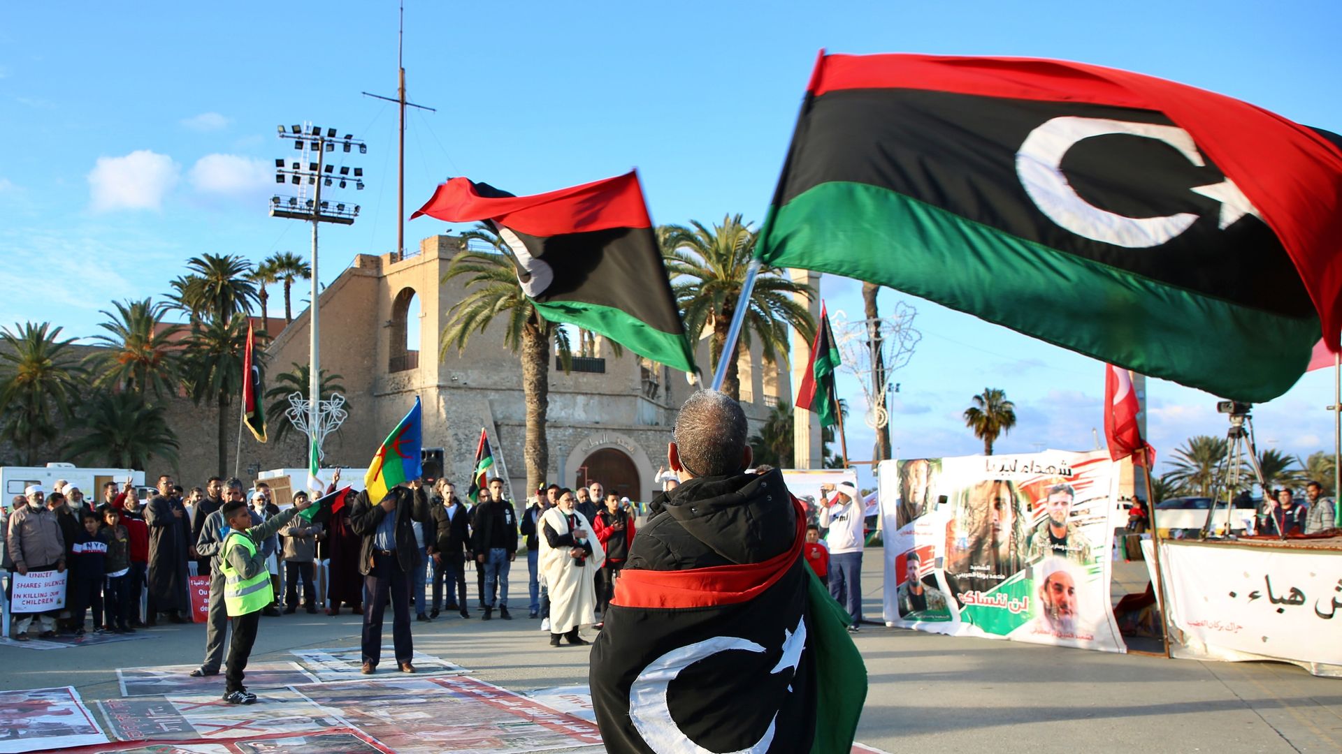 People gather at the Martyrs' Square to stage a protest against attacks.