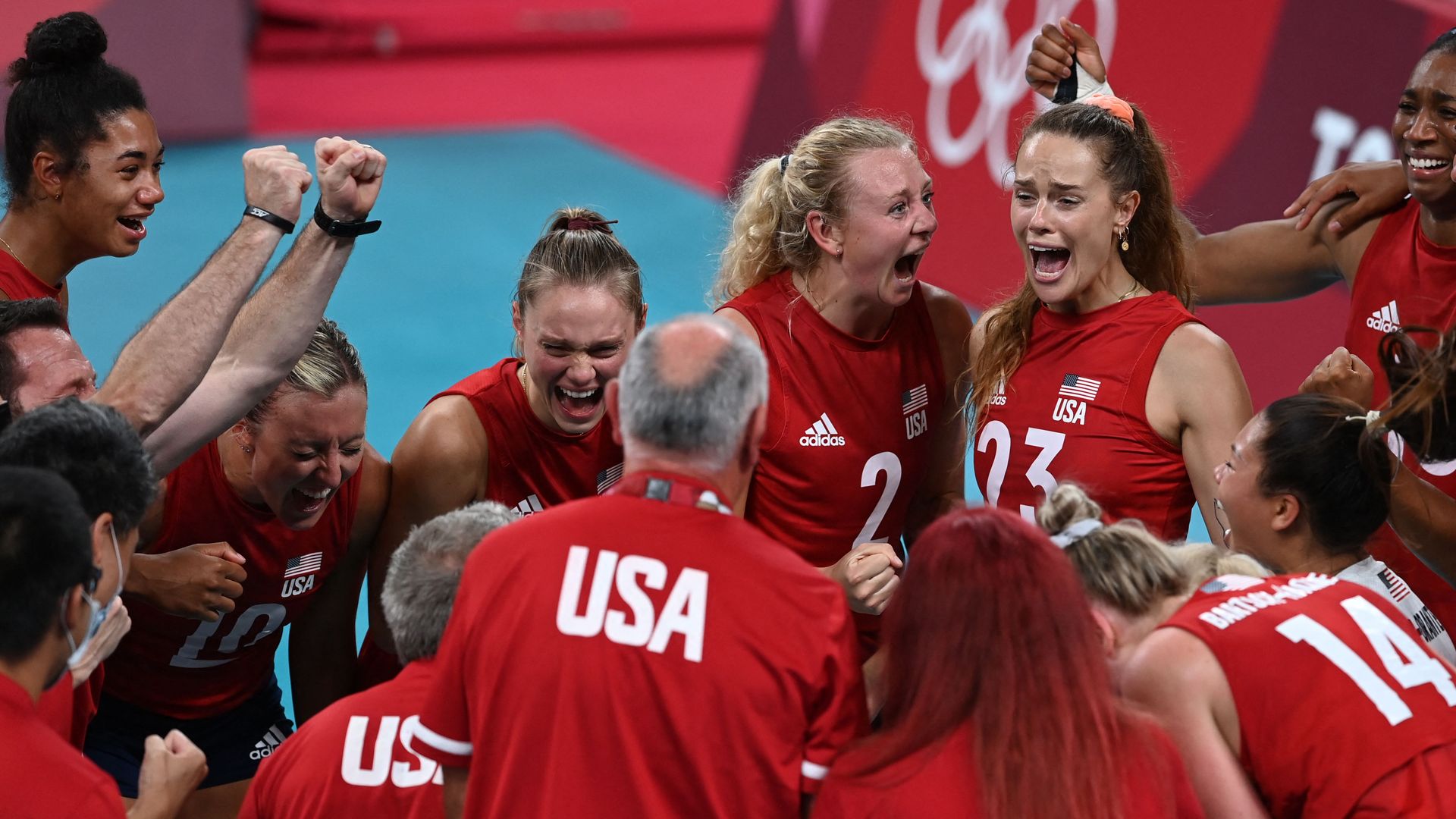 USA's players celebrate their victory in the women's gold medal volleyball match between Brazil and USA during the Tokyo 2020 Olympic Games at Ariake Arena in Tokyo on August 8