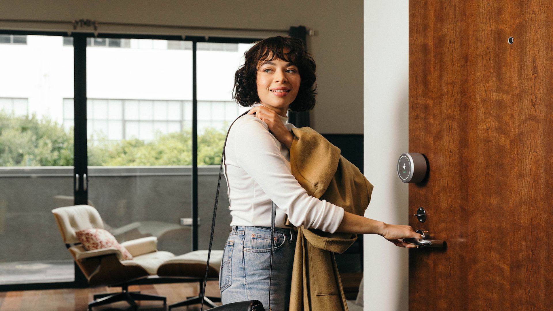 Photo of woman leaving an apartment she booked for a short nap in between business meetings.