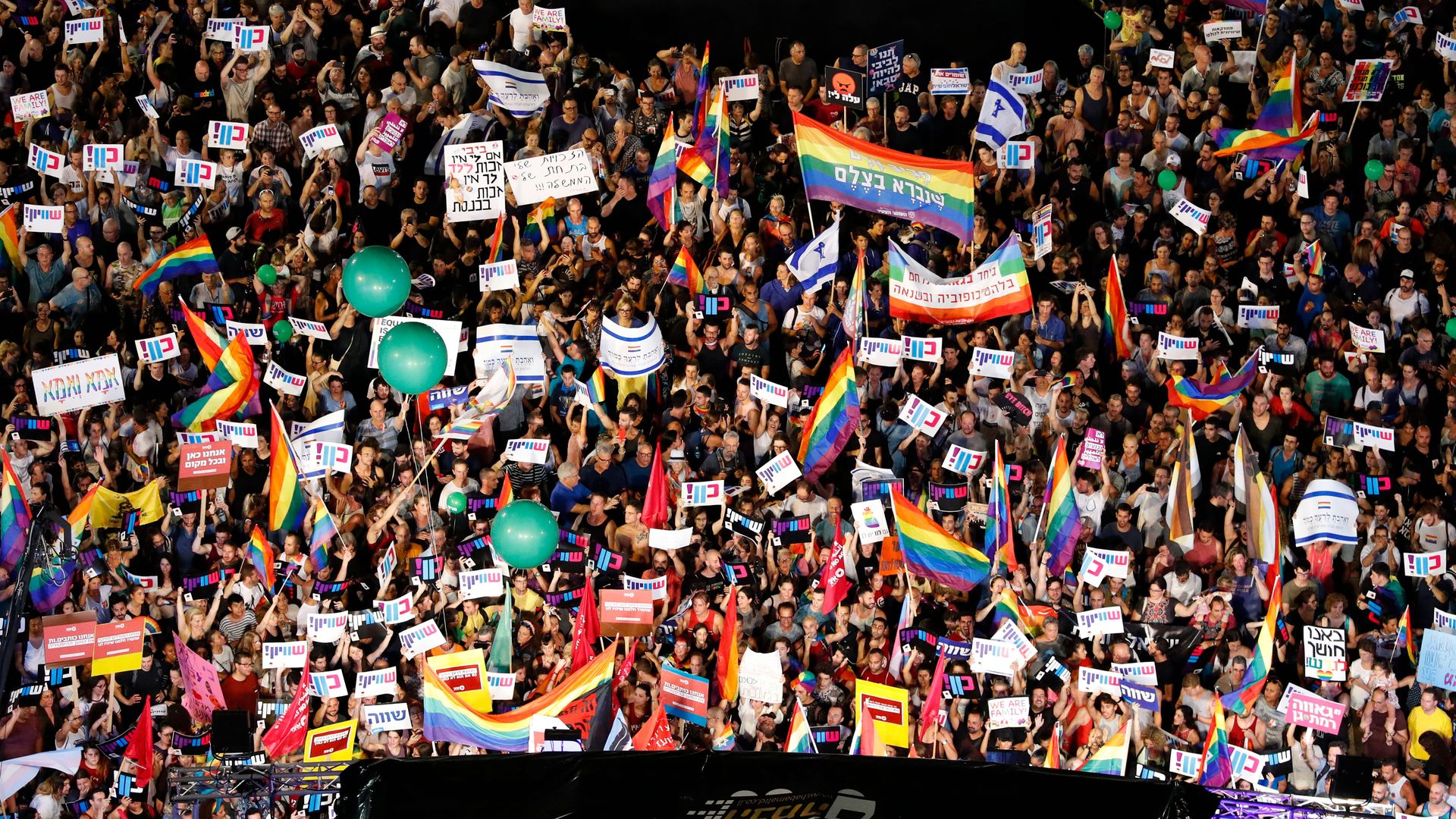 Thousands in Tel Aviv Sunday protesting Israel’s new surrogacy law that does not include gay couples. Photo: Jack Guez/AFP/Getty Images
