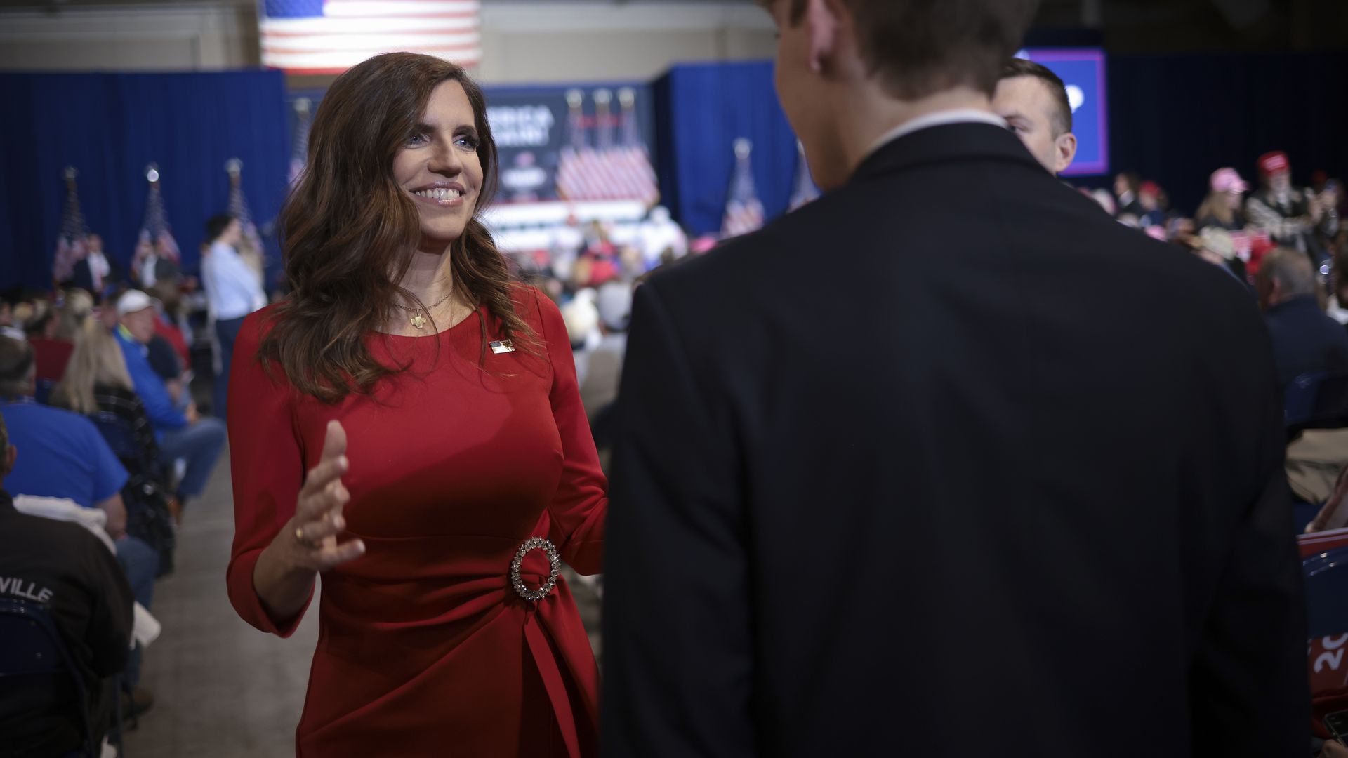 Rep. Nancy Mace, wearing a red dress and American flag pin.