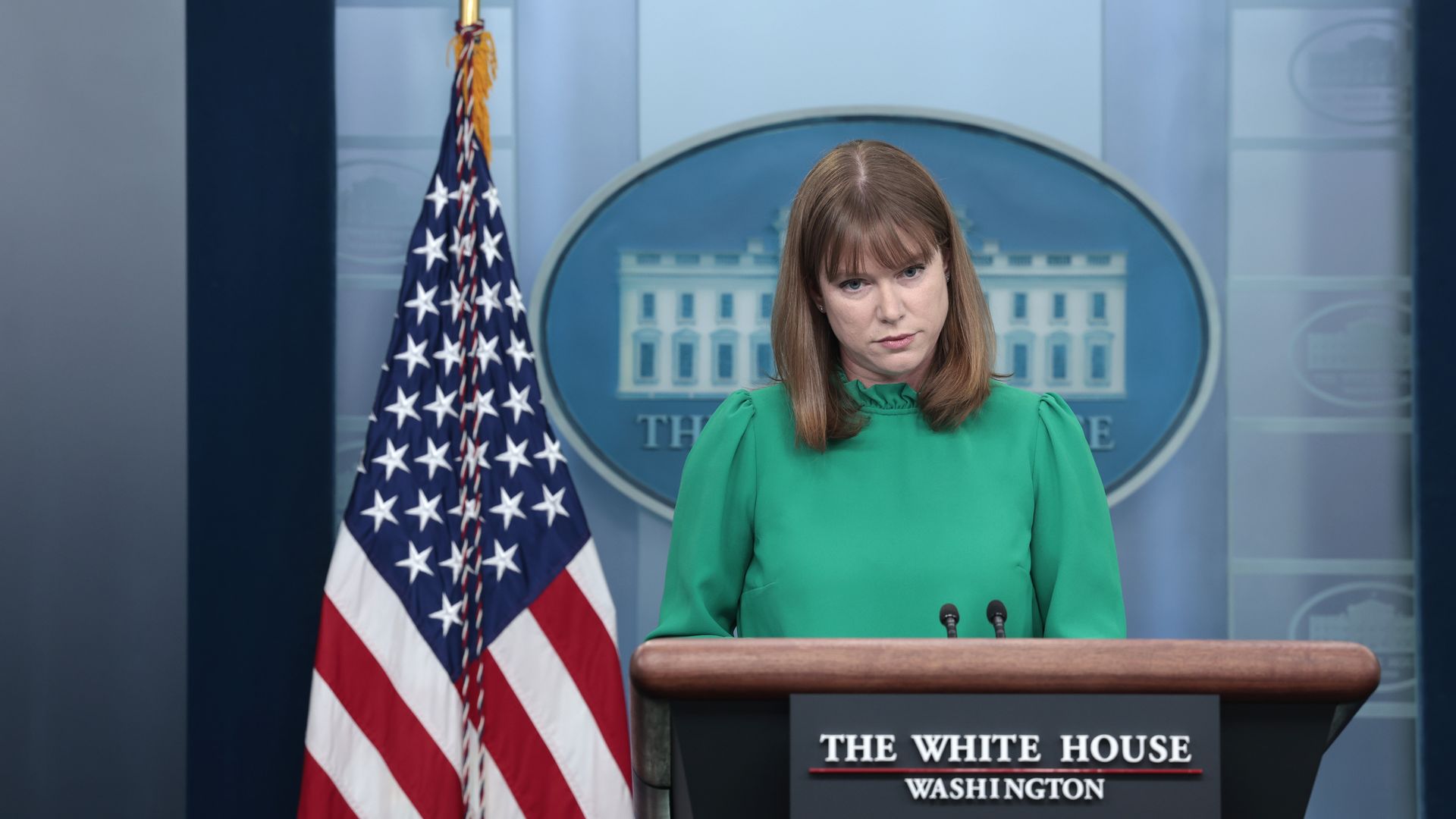 White House Communications Director Kate Bedingfield is shown conducting the daily press briefing.