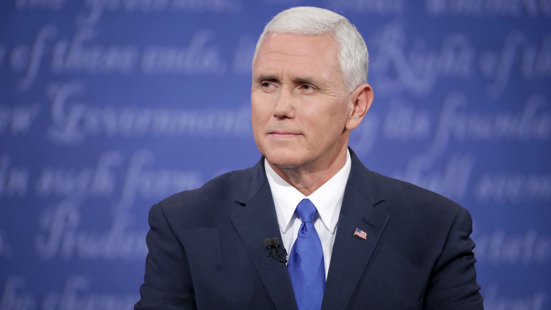 Photo of Mike Pence sitting with his hands held in front of him