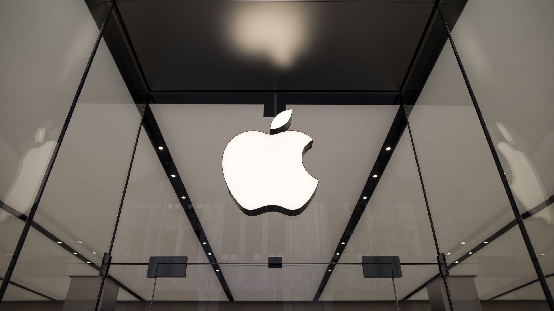 The Apple logo hangs in a store