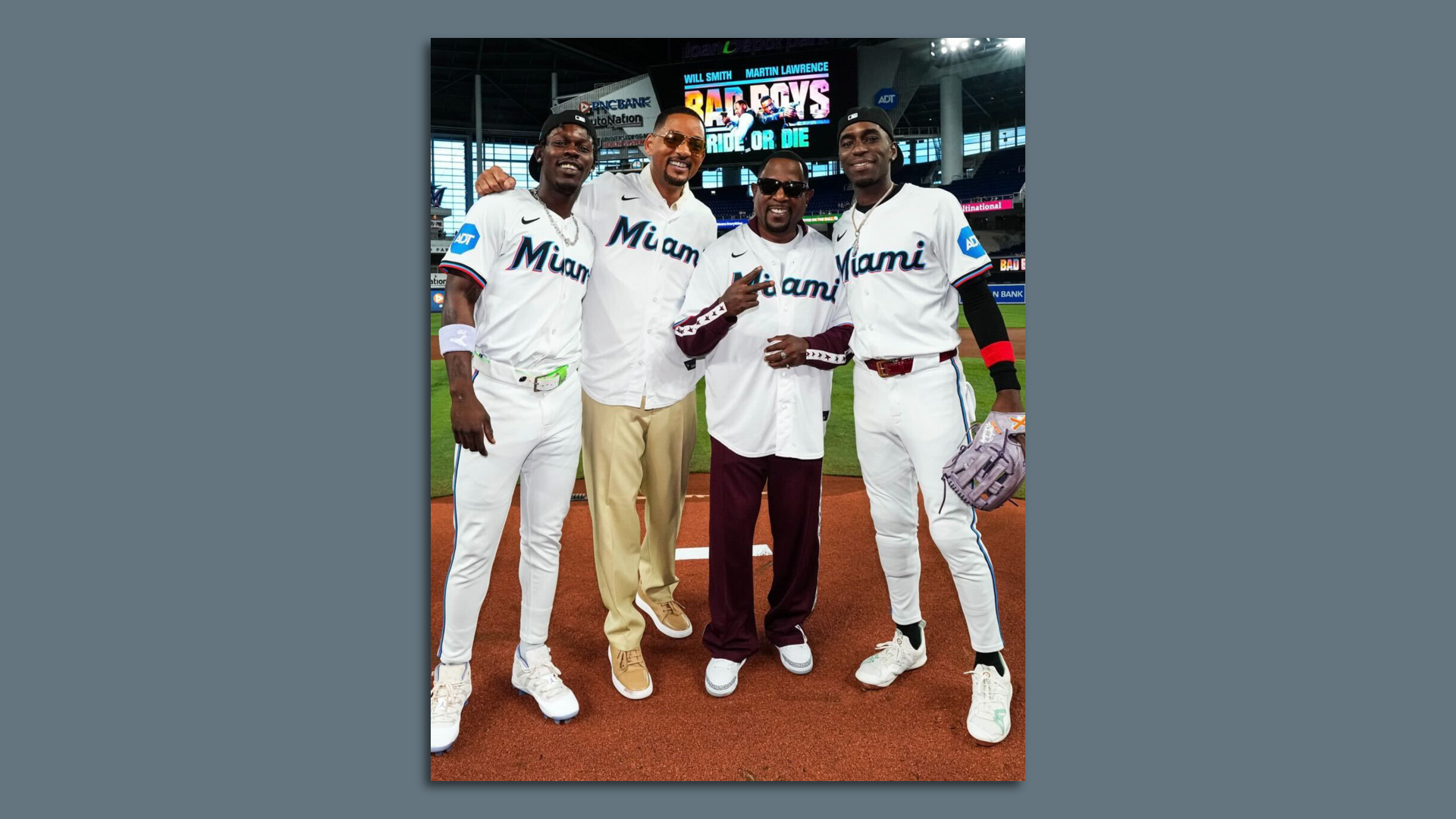 Four men at the pitcher's mound. 
