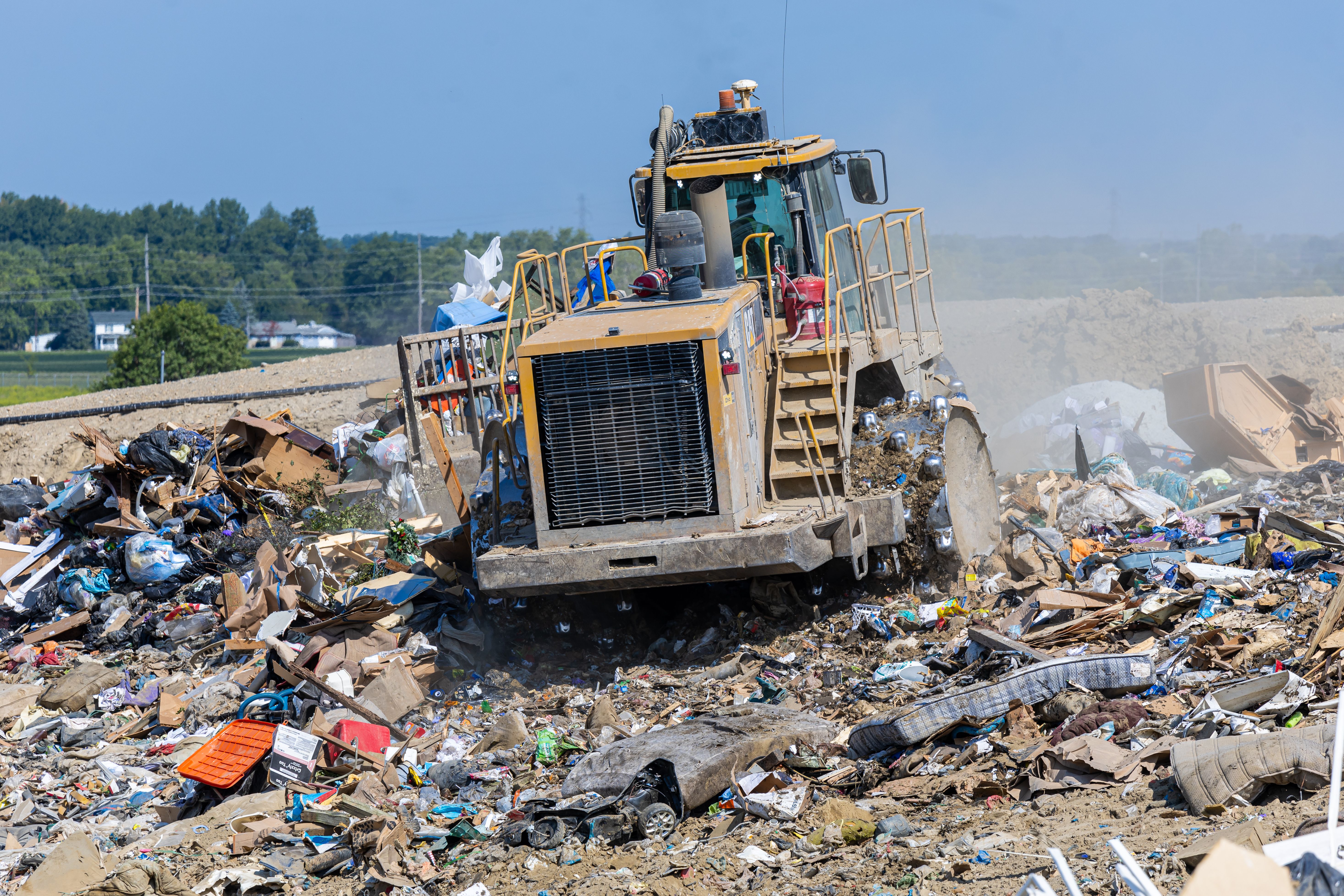 A bulldozer flattens a trash pile at the Franklin County Sanitary Landfill