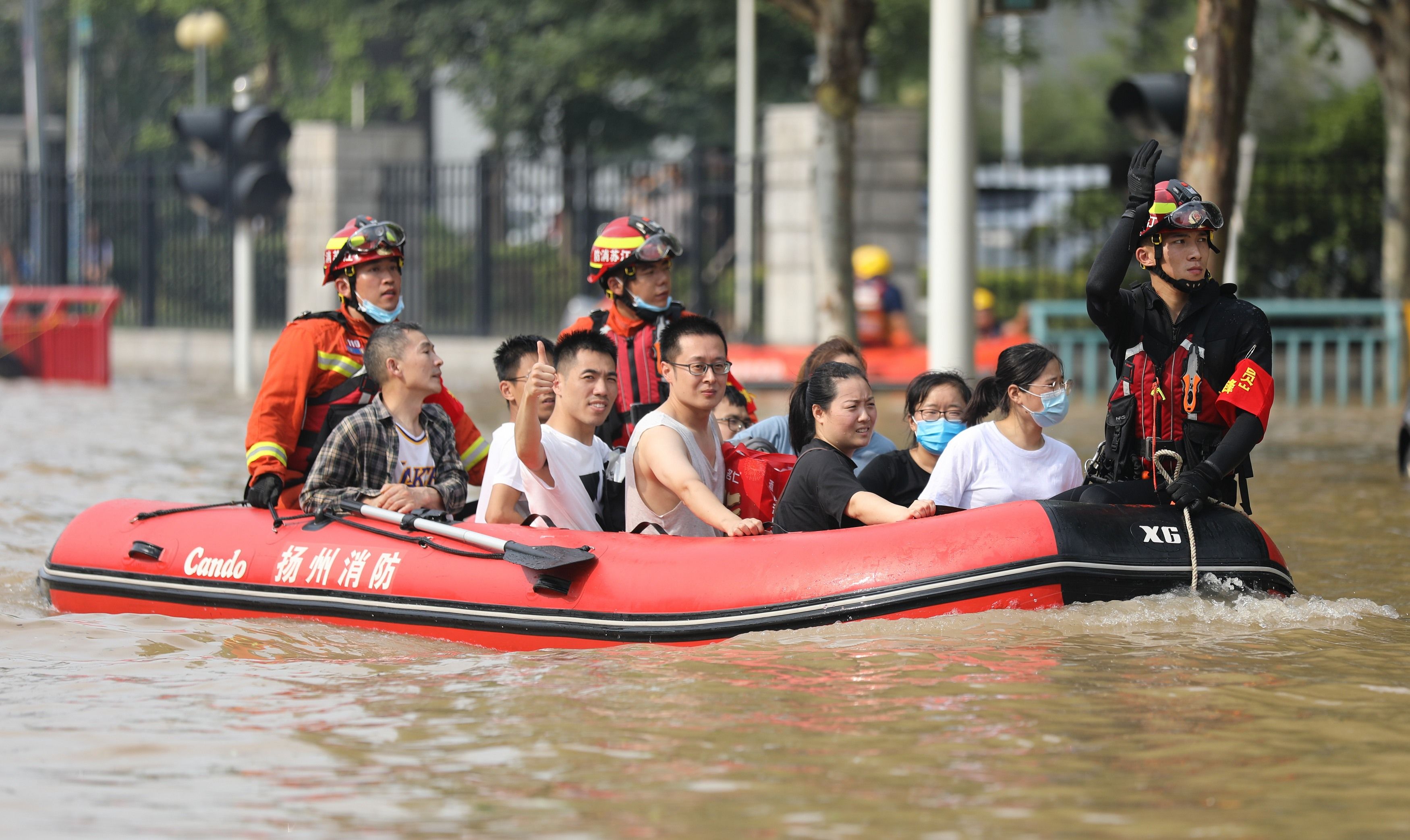 Firefighters rescuing people in Zhengzhou on July 22.