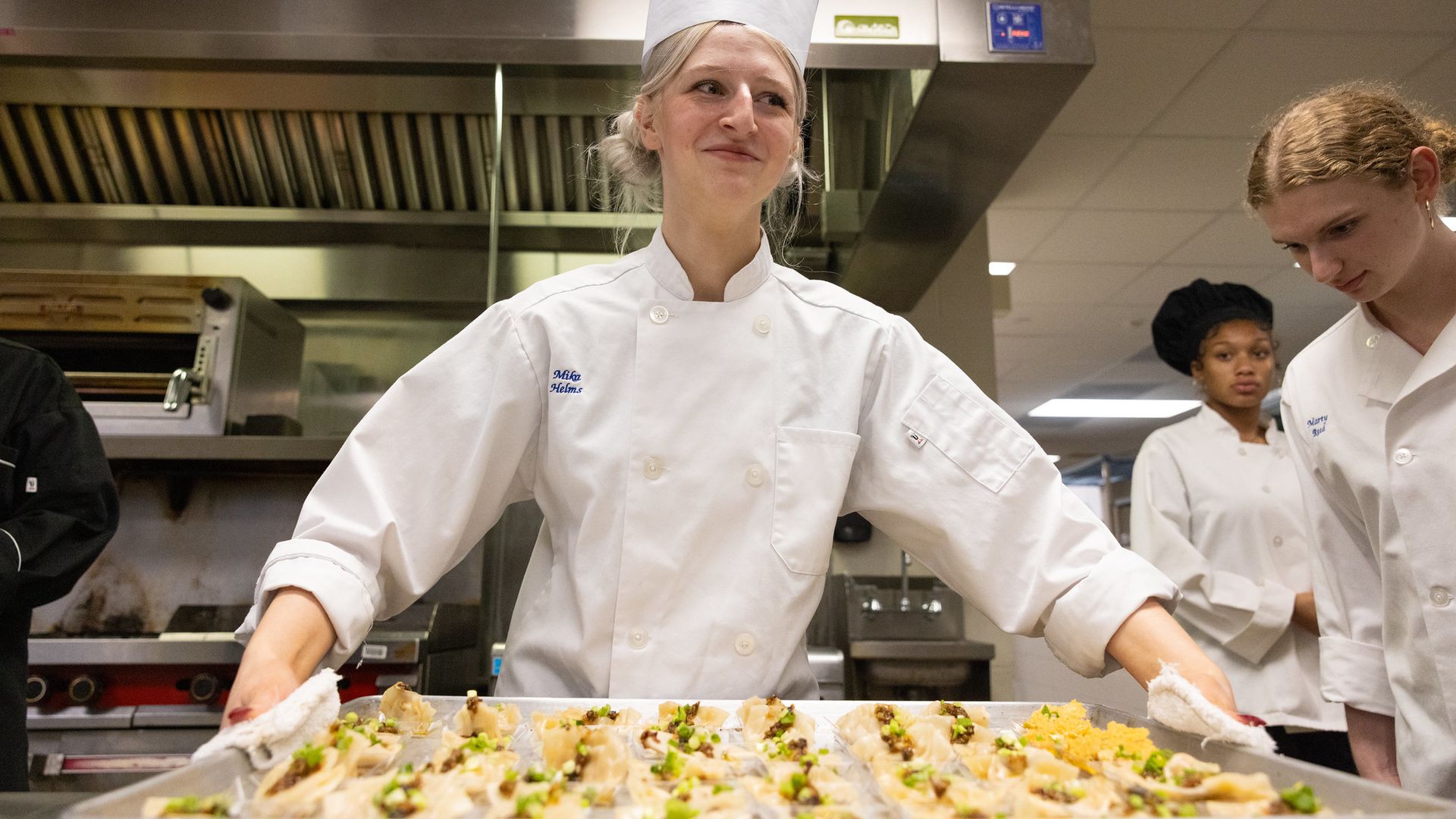 A student holding a tray of food