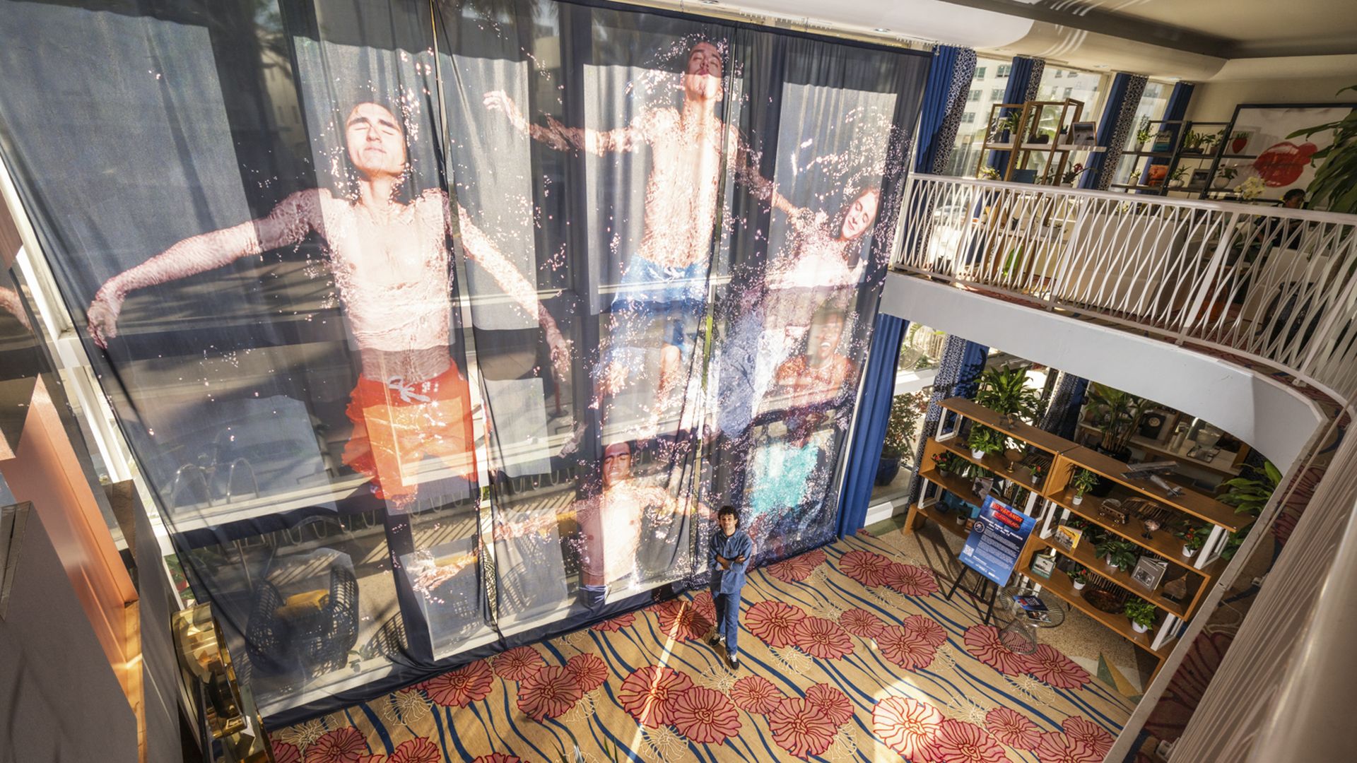A photo is featured on floor-to-ceiling curtains. 