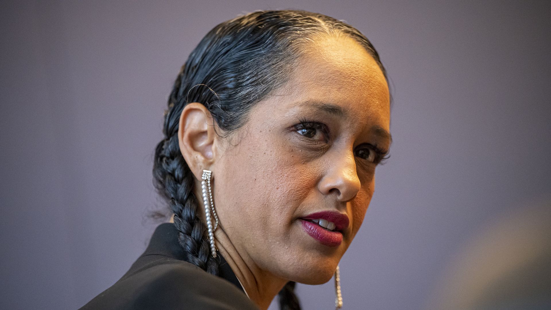 brooke jenkins with her hair in braided pigtails