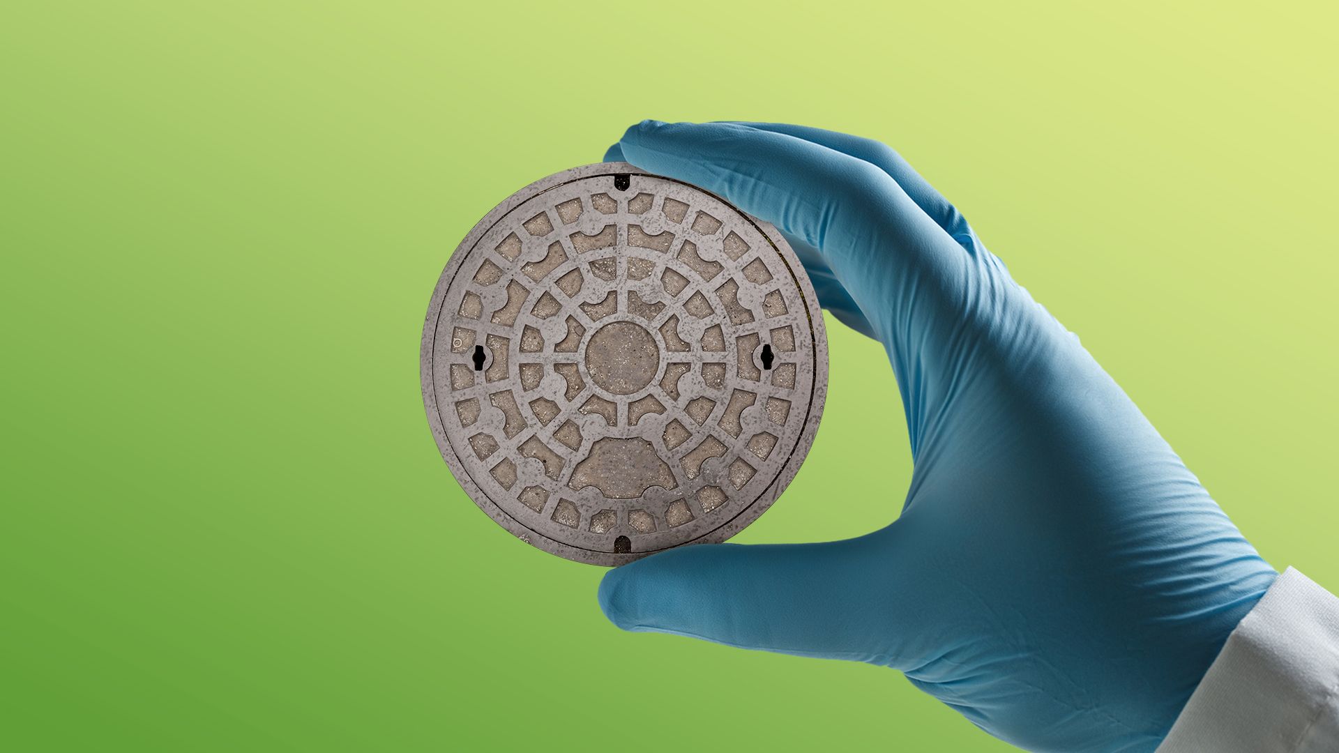 Illustration of a hand with a medical glove on holding a sewer cap up to examine