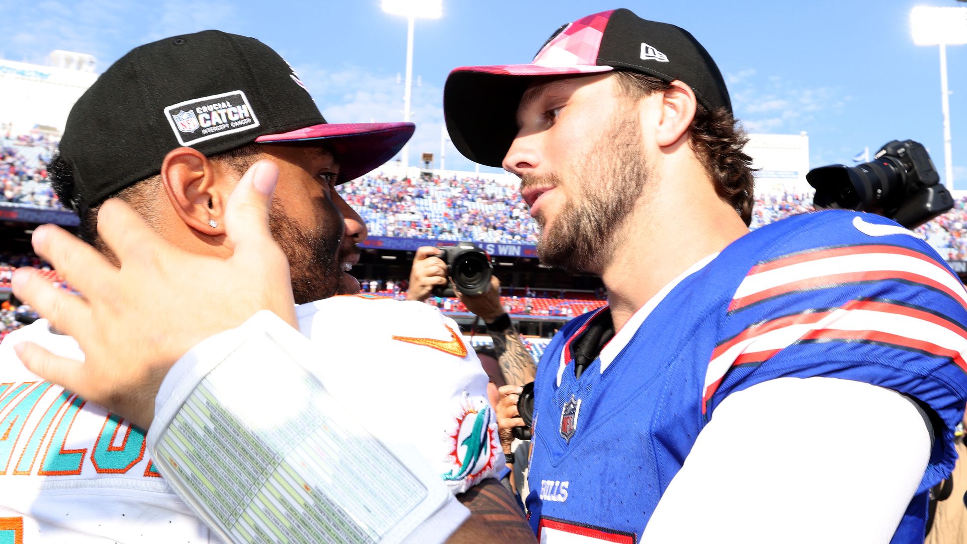 Dolphins quarterback Tua Tagovailoa and Bills quarterback Josh Allen embrace after their game.