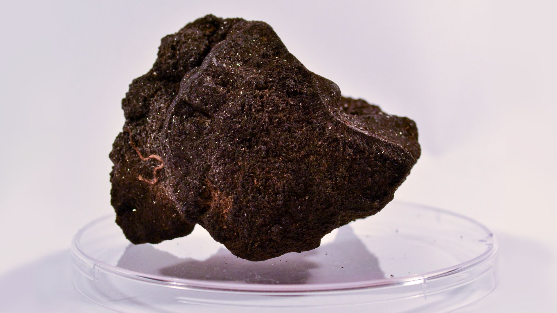 A polymetallic nodule from the new study undergoes testing in a lab at Northwestern University