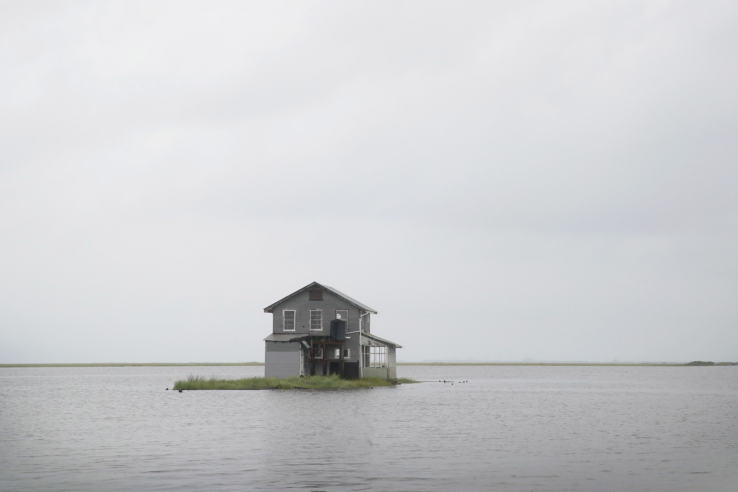 Water recedes from around a fish camp following Hurricane Barry on July 14.