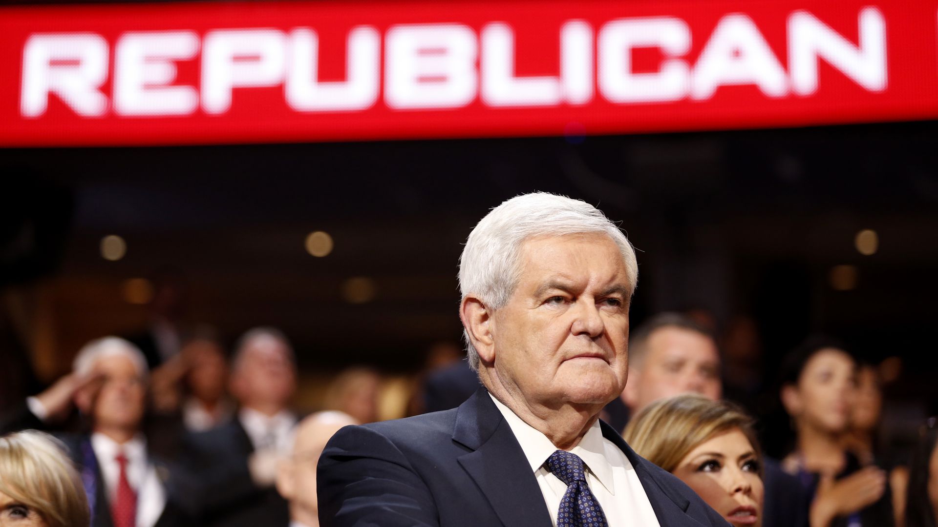 Newt Gingrich, former speaker of the U.S. House of Representatives, stands during the Pledge of Allegiance.