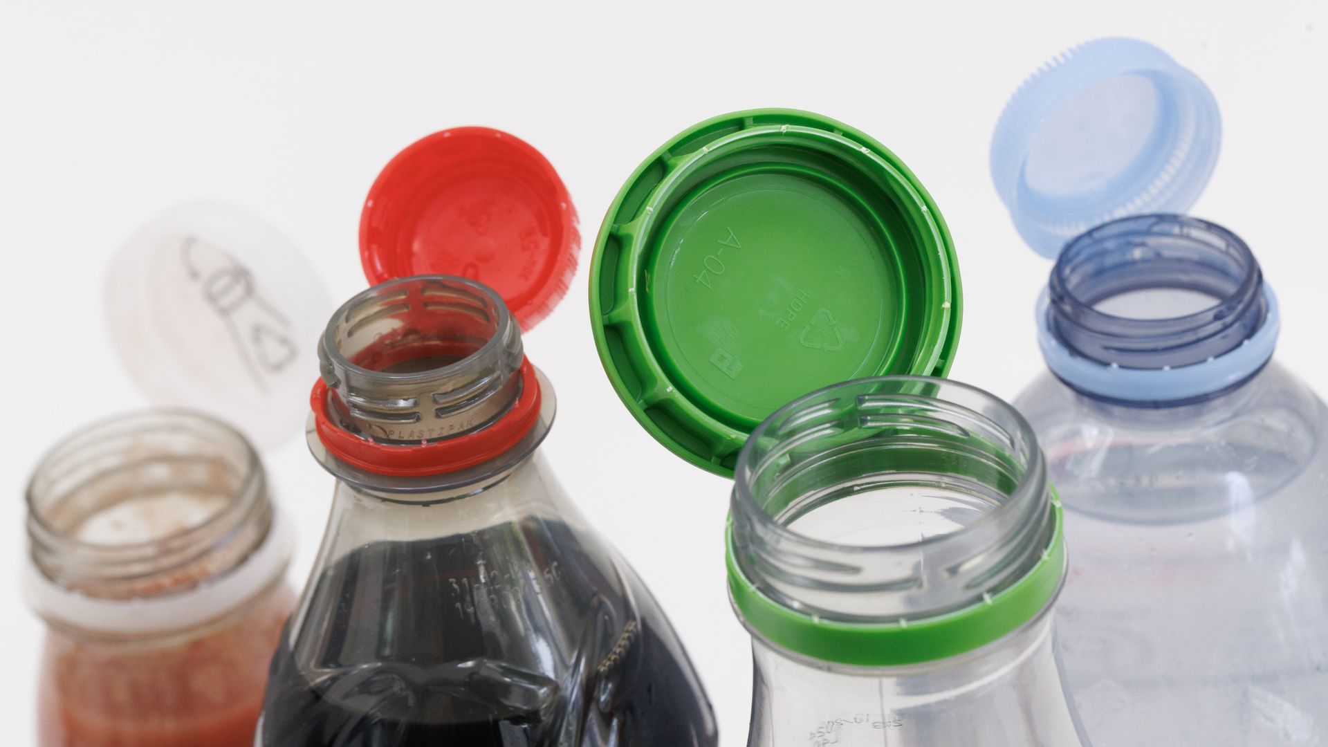 Photo shows bottles with their caps off.