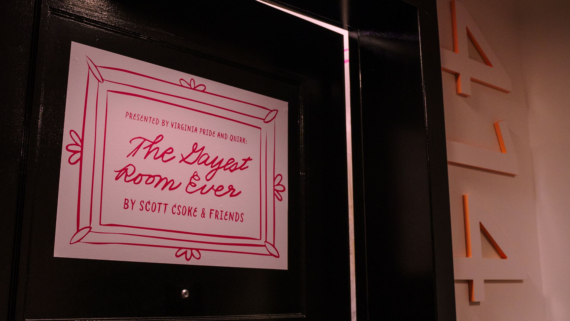 a sign on the door the says "the gayest room ever" 